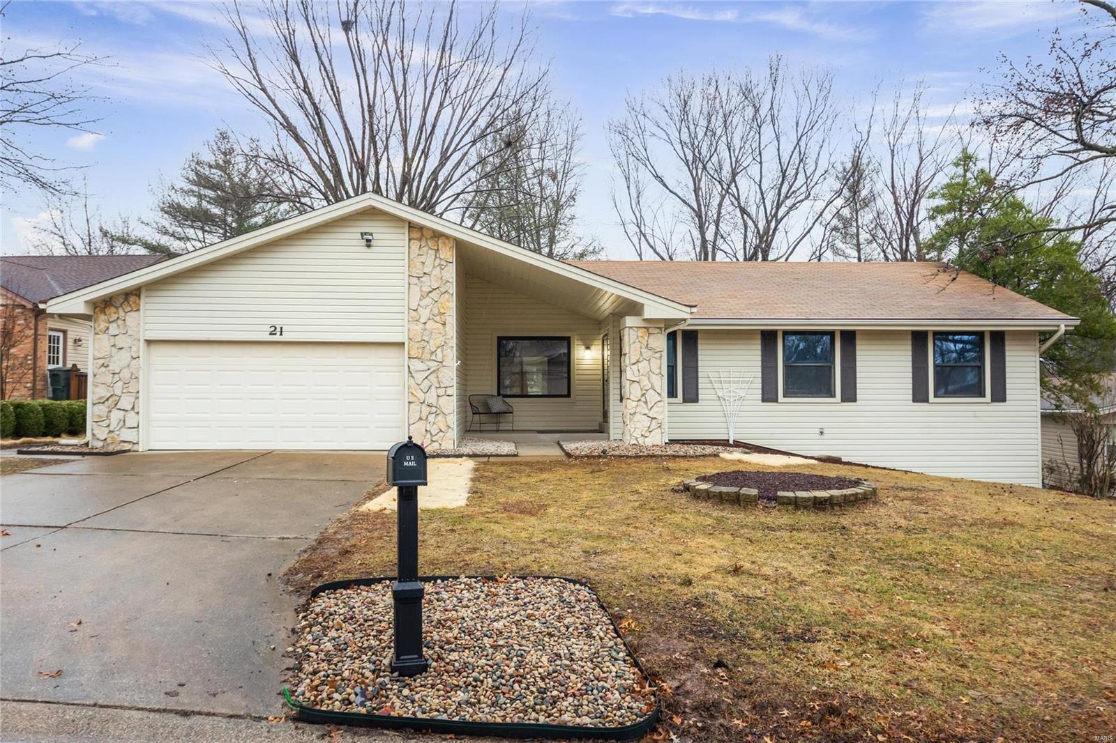 Beautifully renovated home in the sought after Lake St. Louis Community. A stunning vaulted front porch greets you to this spacious 4BD/2.5BA ranch. Inside you will find a fully remodeled home with luxury vinyl plank, new carpet, and fresh paint throughout. The kitchen features stainless steel appliances, new cabinets, a pantry with ample storage, and granite countertops with peninsula seating for four. The kitchen opens up to a large living room with vaulted ceilings and fireplace, which makes the perfect space for entertaining. A large primary bedroom and bathroom, and two additional bedrooms round out the main floor. The finished lower level features another bedroom with half bath, large rec room, and plenty of space for storage. Relax and enjoy the outdoors on your covered patio overlooking your level backyard. The home has a large attached 2 car garage with built in shelving for storage. Time to call this Lake St. Louis gem your home!