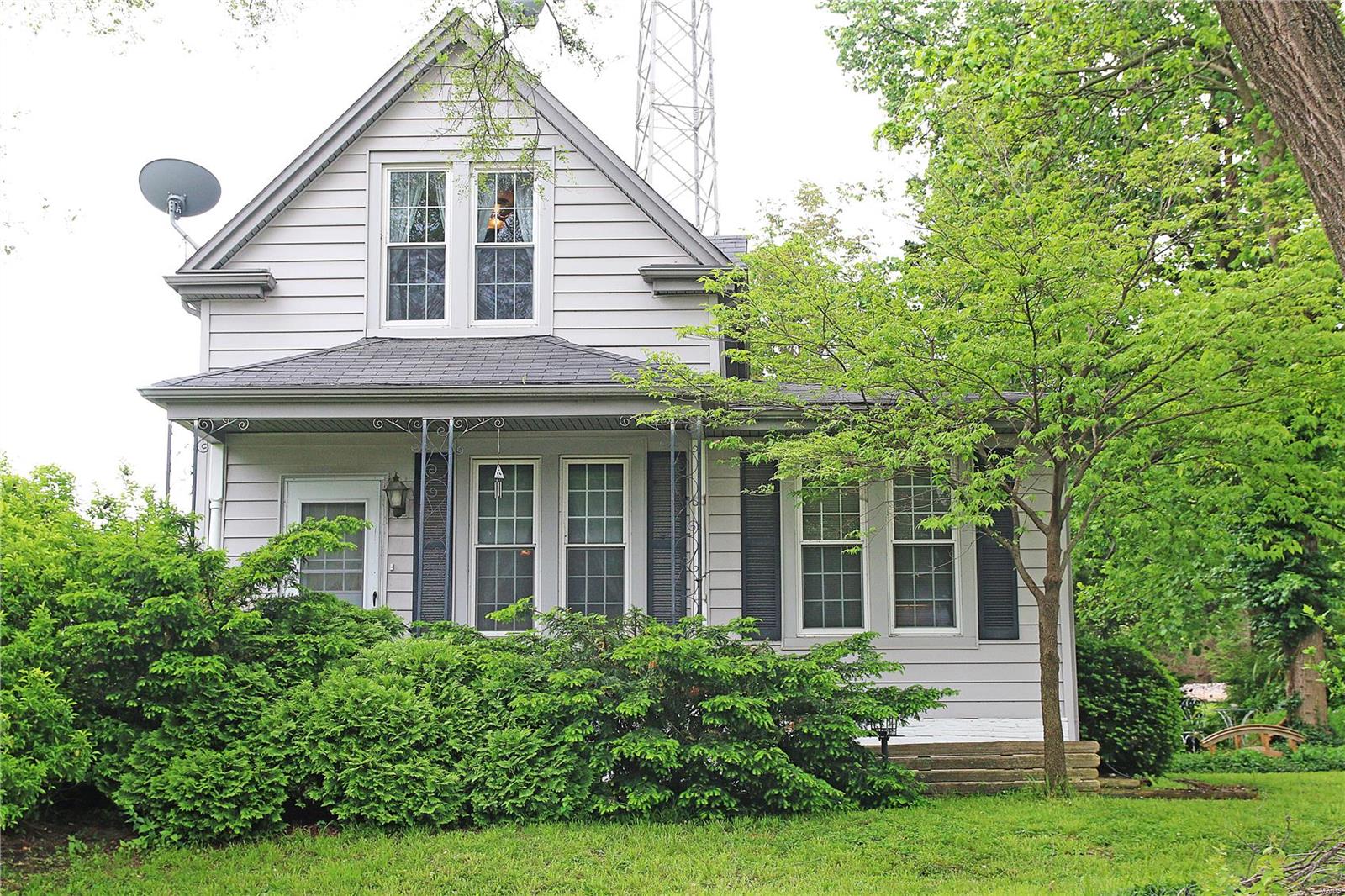 New Price effective immediately! Exceptional Opportunity in Shrewsbury. This unique four bedroom two full bath farm Style home is 1680+ sf. and located in the Webster Groves School District. Loaded with old world charm, the large entry foyer welcomes you home. This amazing home has a huge eat in kitchen w center island. The spacious living and family rooms are bathed in natural light. Cozy fireplace and built in bookshelves are just the beginning. Tall 9' ceilings throughout. Two generous main floor bedrooms and a large full bath. A bright and cheery enclosed porch completes the first floor. Upstairs is two more large bedrooms separated by a huge sitting room with skylight.  The basement is unfinished with lots of storage space. The park like backyard has private patio and pond. Carport and additional parking.  Updates include vinyl siding and vinyl thermal windows. Also of note, this property can also be used as commercial as it is Zoned M-1, the City Shrewsbury. Convenient location. Additional Rooms: Mud Room