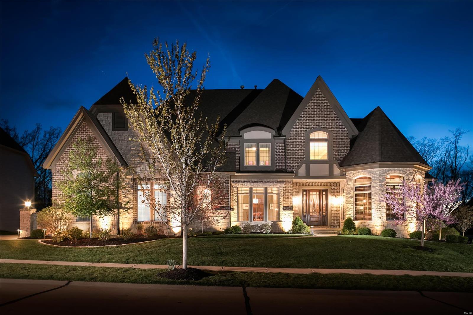The serene setting and magnificent views set the stage for this highly customized home! Careful planning allowed for such features as: Top of the line home automation system indoors & out, chef's kitchen including Wolf range & hood, 30" Wolf double oven, 2 Subzero fridges, floor to ceiling custom cabinets, coffee/wine station w/ wine cooler, expanded Hearth Room, automated custom window treatments to enhance day to day living! Architectural features include cathedral & vaulted ceilings, custom bookcases, 8ft Mahogany front door, 8ft solid interior doors throughout, job finished white oak flooring, custom molding, beamed ceilings & an expanded Master suite. The exterior is equally as compelling and includes a 20'x32' saltwater pool, premium cul de sac lot backs to wooded common ground; Extensive professional landscaped, fenced lot, patio, large open deck & covered deck! Finished walk out LL w/ 5th BR, full bath, theater room, exercise area, wet bar & family room. See Attachment A in MLS
