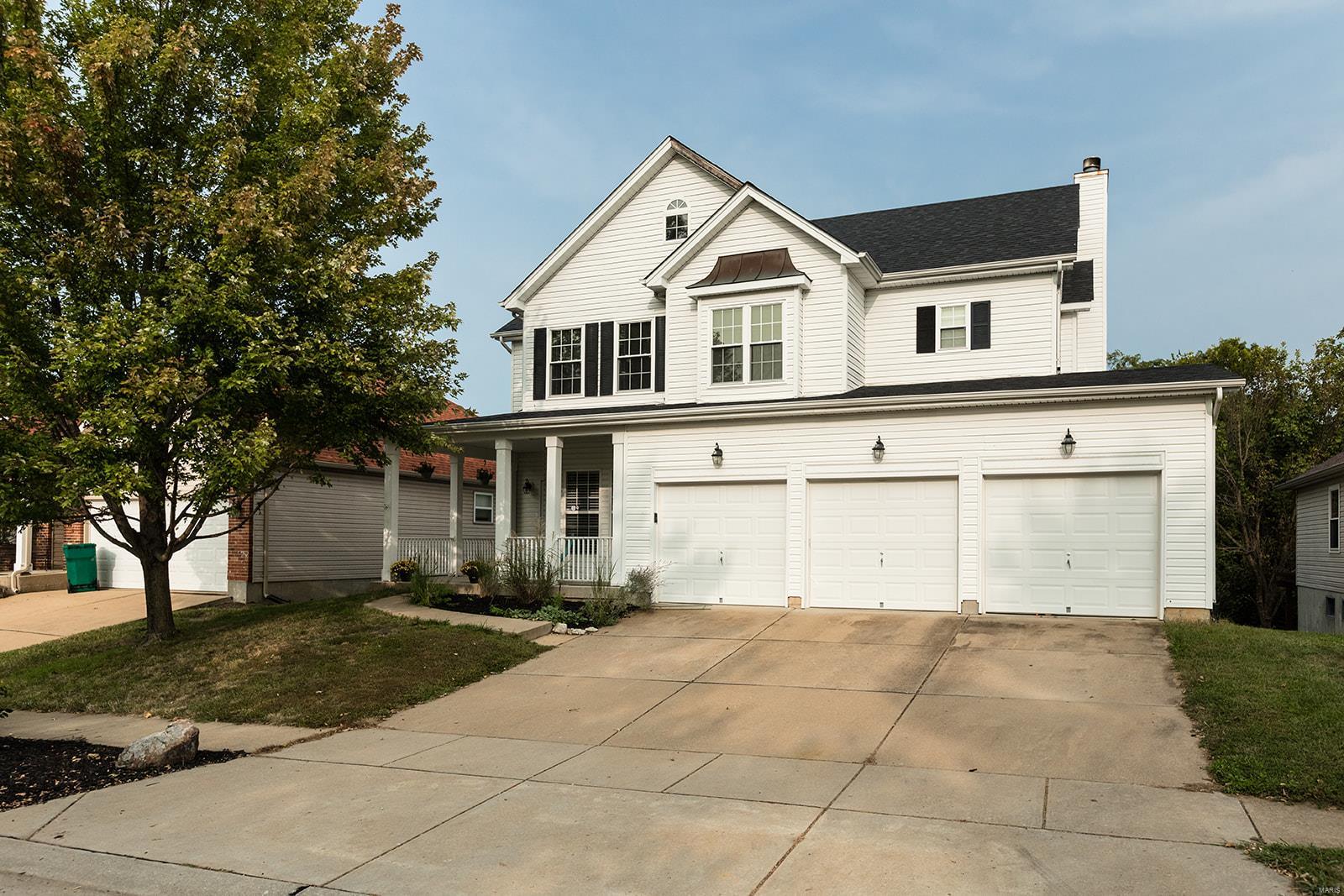 This lovely two story home welcomes you with lovely curb appeal, a three car garage and a cozy front porch to sit and relax on these cool fall evenings. Main floor features include the living room, dining room with bay window, a spacious kitchen with a large breakfast bar,  a breakfast room overlooking the yard and woods and finally the large great room with stunning coffered ceilings and a gas fireplace. There is also a deck off  of the breakfast room for your bbq's. Upstairs you will find the large master bedroom suite with a walk in closet, master bath featuring double vanity, separate shower and jet tub.There are three other nice sized bedrooms and a second level laundry!! Wow, who wouldn't need that! The lower level is unfinished, but awaits your finishing touches with a rough in for a bath and walkout to the rear yard. All of this and on a quiet cul-de-sac street and close to interstates, shopping and restaurants.