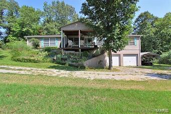 PRICE REDUCTION!!!  Enjoy country living on 5 acres just outside of Gordonville.  Huge home with living room, family room, plus an enclosed sun-porch.  Master bedroom has bath with open vanity area and Jacuzzi tub plus a shower.  Full basement with 2 car garage and lots of storage  plus shop area. Perfect for horses including existing barn. If country living is what you're searching for you must check this one out!  MOTIVATED SELLER!!!  Make an offer!
