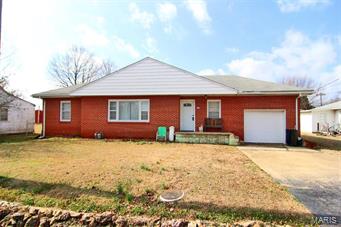 All brick 3 bedroom, 1 bath ranch.  1 car garage, 2 outbuildings, chain link fenced, 10x12 deck.  Hardwood floors in entire home except linoleum in bathroom.  Priced to sell!