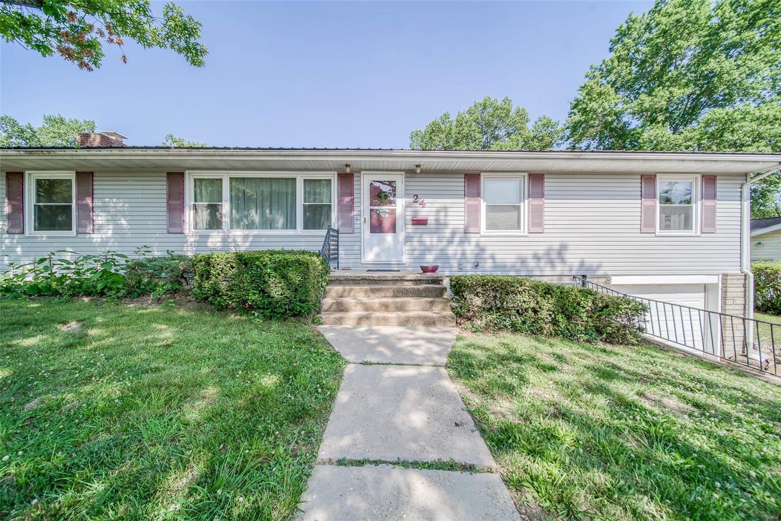 AFFORDABLE 3 BEDROOM, 2 BATHROOM HOME ON A PRIVATE CUL DE SAC! Centrally located near parks and schools in Rolla, this charming home offers so much space! Entering from the front porch you are greeted with a sundrenched living room that flows into the dining area and kitchen with a door leading to the large, level backyard.  The cozy kitchen features plentiful cabinets, tile backsplash, and a breakfast bar. The spacious family room boasts built-in shelving, a massive brick non-functioning fireplace, and sliding glass doors leading to the patio.  Rounding out the main level of this home are 3 bedrooms with hardwood flooring and a full bathroom.  Downstairs is another full bathroom, a bonus room, and tuck under 1 car garage.  Don't miss this awesome investment opportunity! Schedule your private showing today!