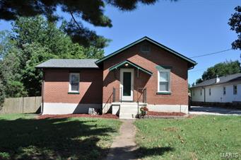 OPEN SUNDAY AUGUST 30, 1 - 3 p.m. Wonderful brick bungalow on nearly a half an acre level lot.  Recent updates include; new roof (2014), laminate flooring in all rooms aside from kitchen (2010), new furnace (2013), hot water heater (2010), deck and entry porch (2014). Additional features include a sleeping space in the lower level, plus a full bath, and a large recreation room with walk out access.  Many possibilities for this home and the large fenced lot.