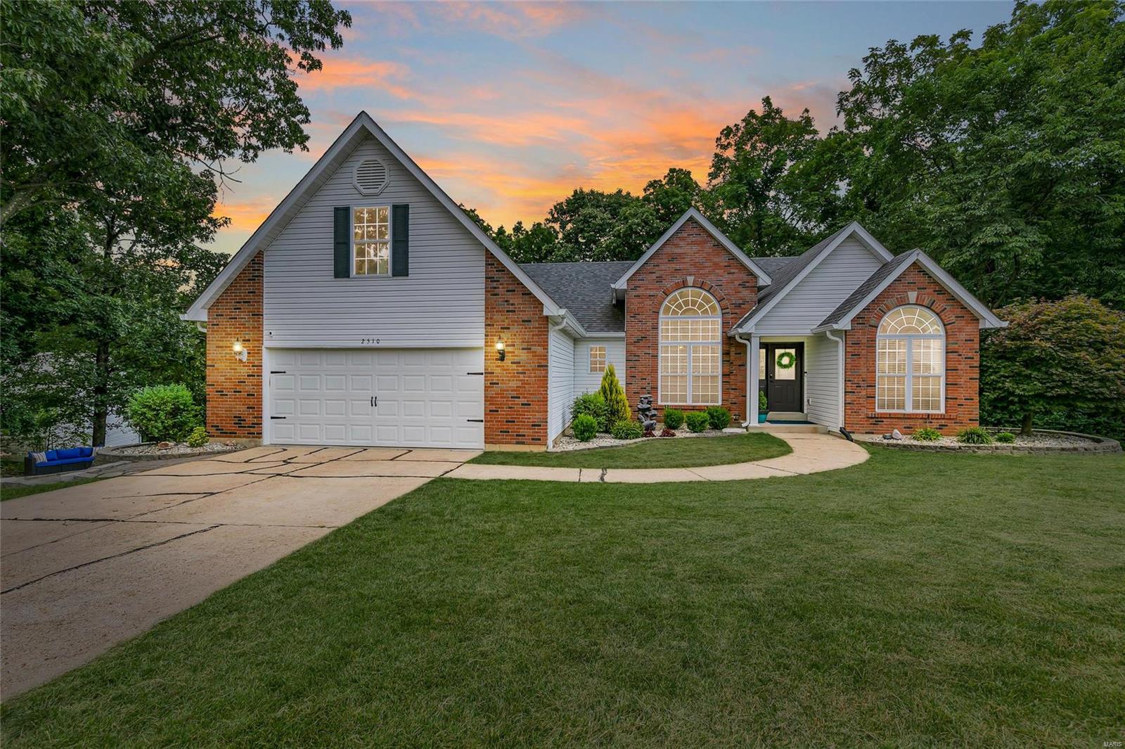 Nestled on an acre in the quiet gated subdivision of Eagle Farms, this atrium ranch is surrounded by nature and privacy. With over 3,000 finished square ft, boasting new ebony hardwood floors, new carpeting, new HVAC, kitchen and bathroom renovations, newer roof & gutters, and so much more. The master suite will impress with a sitting room, large master bath with double sinks, and walk in closet. The open concept main living features vaulted ceilings, a wood burning fireplace, and atrium windows that allow natural light to pour in. Main floor laundry! Three bedrooms and two full baths complete the main level, with a 4th room/office in the lower level which can be easily converted to a legal 4th bedroom. The walk out basement is open and bright, with recessed lights, media room, rec space, and plenty of storage area. Enjoy your morning coffee on the new deck, bonfires at the side yard fireplace, and gorgeous forest views from the backyard. Perfect home for all four seasons. Tour today!