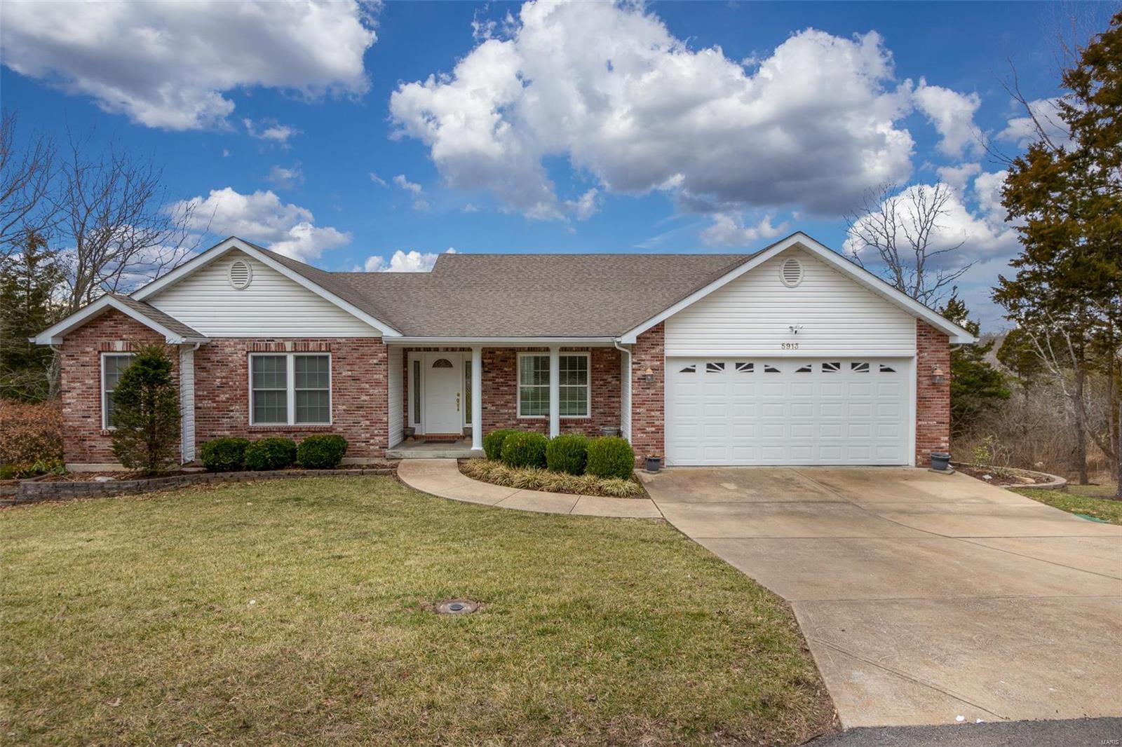 CONTINUE TO SHOW AND SELL! This rare opportunity includes adjoining lots w/home backing to golf course. Elegance throughout w/over 3650 sq ft of living area! Lower level designed for entertaining in mind! Decorative arch design, elegant built in bar w/custom cabinetry & Fam Rm w/fireplace welcomes you from a hard day of play! French doors open to large deck overlooking golf course. Overnight guest can enjoy their stay w/private bdrm & full bath. Side double door entry w/ easy access for golf cart, safe room & storage area. Great Rm on main level has 2nd fireplace, cathedral ceiling w/custom windows for a beautiful view. Din Rm opens to Kit, which boasts custom cabinetry, lg pantry, brkfst bar, coffered ceiling & large eat in area w/bay window. Side windows offer a view of landscaped yard. Front bdrm has been used for study. Luxurious Mstr suite has bay window, walk in closet, coffered ceiling, jet tub, sep glass shower & double sink w/dressing table, the 3rd bdrm includes private bath.
