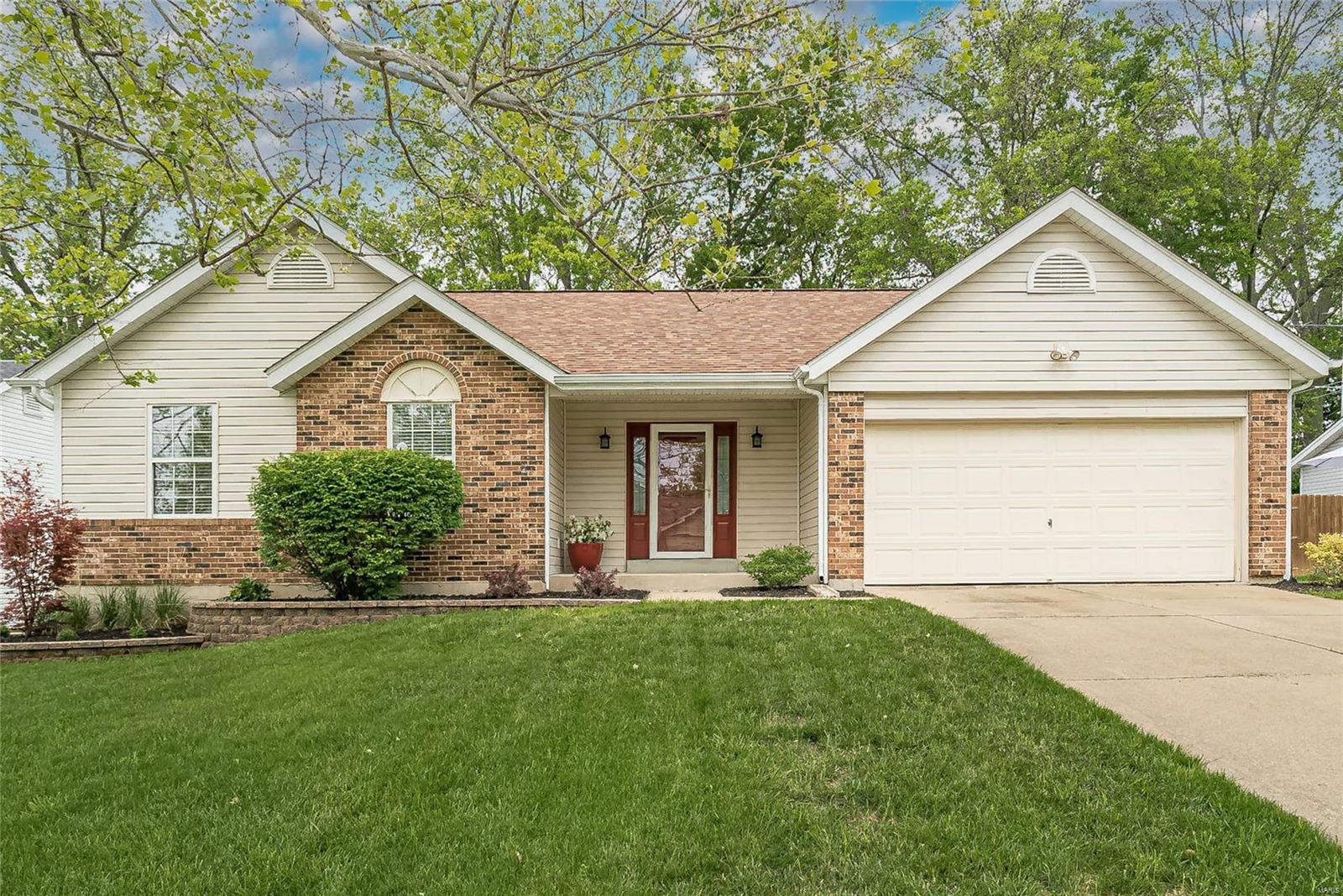 Come home to this fantastic ranch w/3 bedrooms & 3 full baths located in desirable Francis Howell School District. Many significant updates in the last five years. A new inviting front door welcomes you to the open floorplan in soft hues of gray. Luxury wood-look laminate floors flow seamlessly through the main space. Vaulted great room w/woodburning fireplace. Stylish kitchen features crisp white shaker cabinets w/crown molding, granite counters & stainless steel appliances and breakfast room. A new sliding glass door expands the living outdoors to the 29x16 multi-level deck & large, fenced yard. Down the hall is the master bedroom w/walk-in closet & private bath; plus two additional bedrooms & hall bath. A finished lower level offers a huge rec room, laundry & two bonus rooms w/closets, and 3rd bath. Other features: two-car garage, ceiling fans, new roof 2016 & more. Close to schools, recreation, restaurants, shopping & public transportation. This move-in ready home is a great find.