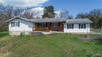 Welcome to 200 Oak Tree Lane located just off of Clearview Road. The location is semi-private & offers easy access to both towns of Washington/Union. Even the commute to the St Louis area is painless. The home features three main floor bedrooms, three full baths, a main floor & lower level laundry hook-ups. Other features include a large living room that flows easily into the dining & kitchen areas as well as the beautiful hearth room featuring the full wood burning or gas fireplace. With all of this space you will easily find ample room to entertain those large gatherings of family and friends. The master bedroom offers lots of closet space and the full private master bath. The two car garage will easily serve to protect the vehicles and there are two other structures on the property for the equipment, tools, toys, and general storage. When inquiring about the property be sure to ask for the sheet containing the many additional features and improvements made over the past few years.
