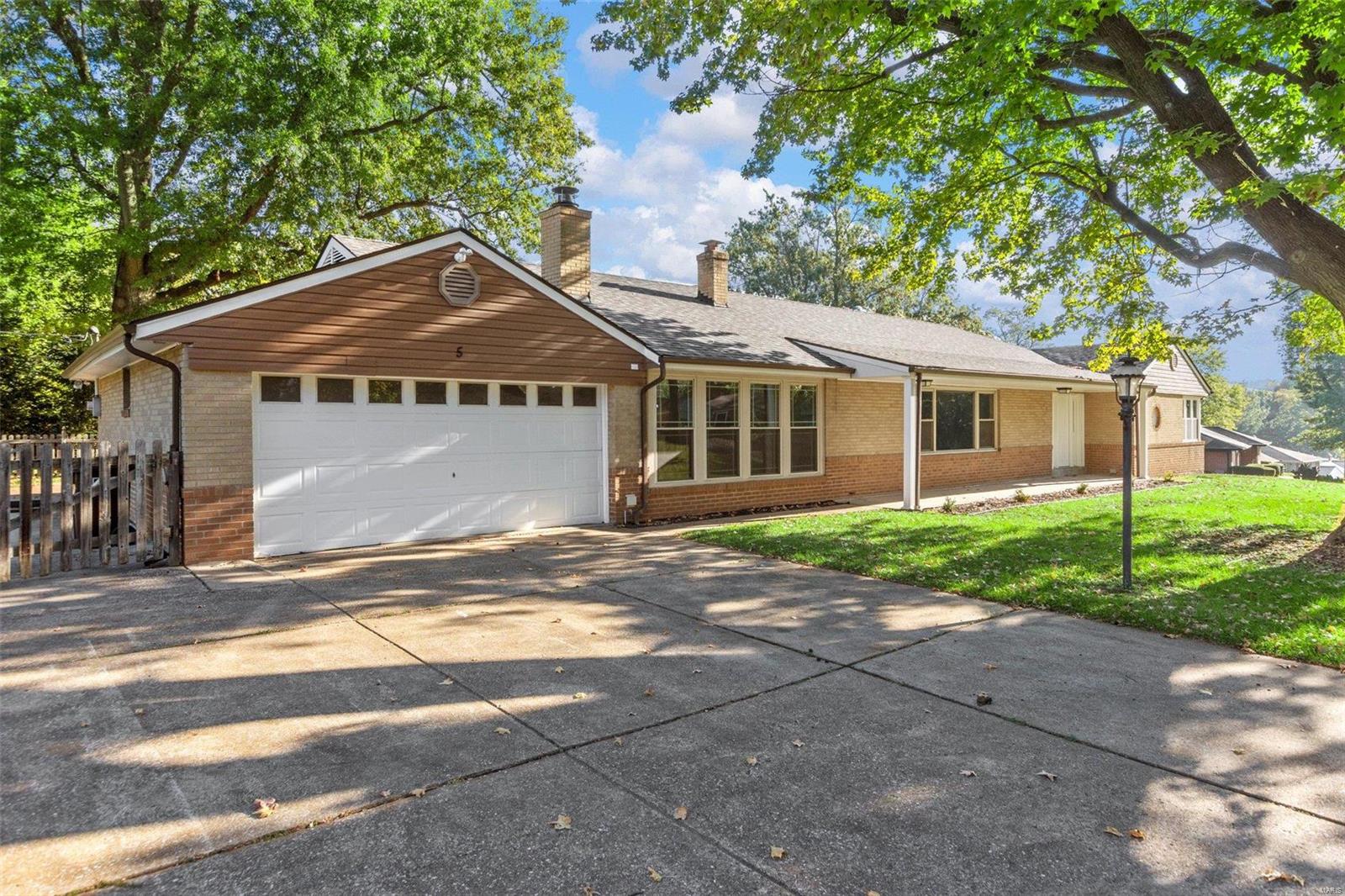 Beautifully renovated 3 bedroom, 2.5 bath ranch Home in a quiet neighborhood. The home boasts 4,500 square feet of living space! As you walk in, you're greeted by a spacious family room that opens to a modern kitchen featuring 42" shaker cabinets, quartz countertops, and SS appliances. The living room is a cozy retreat with floor-to-ceiling windows at each end and a lovely wood-burning fireplace. On the main level, you'll find 3 roomy bedrooms, with the master showcasing multiple closets and a private en suite bath. Heading downstairs, the basement opens up to a large living area, bonus room, 2 storage rooms, half bathroom, and a laundry room. Outside, the fenced backyard offers a deck and a charming brick patio and parking pad large enough for an RV. Completing this property is an oversized two-car garage that opens to a finished utility room.  Recent upgrades include new windows and newer roof. Don't miss out on making this your new home! Listing agent has ownership interest.