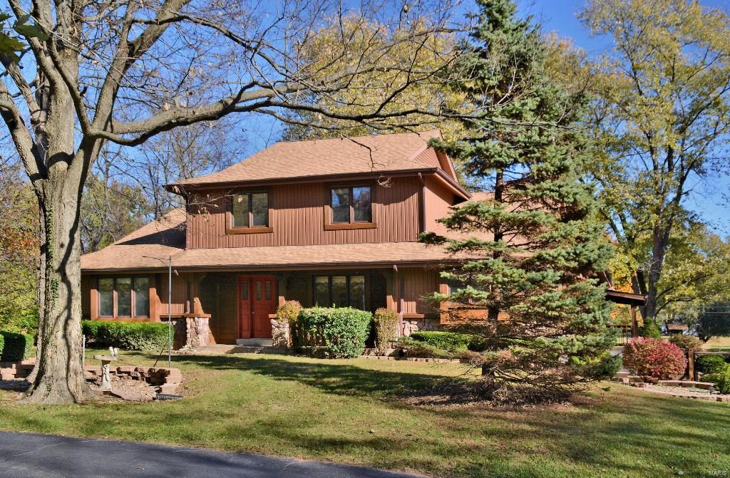 A picturesque setting, amidst trees & level fields, is home to this 1.5 story. Featuring 3 br, 2.5 baths & approx 2,664 SF of living space.Set on a private 3 ac lot, w/ screened porch & patio.Tile flooring welcomes you into the foyer, the DR opens through an arched doorway. In the sunken 2 story GR a floor-to-ceiling stone WB FP, open staircase to upper level with balcony. Tile flooring in open kitchen w/ raised panel oak cabinets, tumbled stone back splash,quartz counters, Jenn-Air downdraft smooth surface cook-top, wall oven, dishwasher,lg island & pantry.Master suite w/box bay window,adjoining bath complete w/ tile flooring, dbl vanity, 2 walk-in closets, & private shower/water closet. Upstairs you will find 2 bd rms, serviced by a tiled hall bath.A spacious 35’x24’ barn w/ full loft, concrete floor, electricity, main level insulation, & 2 garage doors.An OS 2 car tuck-under garage,MFL, half bath, sun room, cedar closet, newer roof in 2012,retaining walls & spacious LL. Additional Rooms: Sun Room