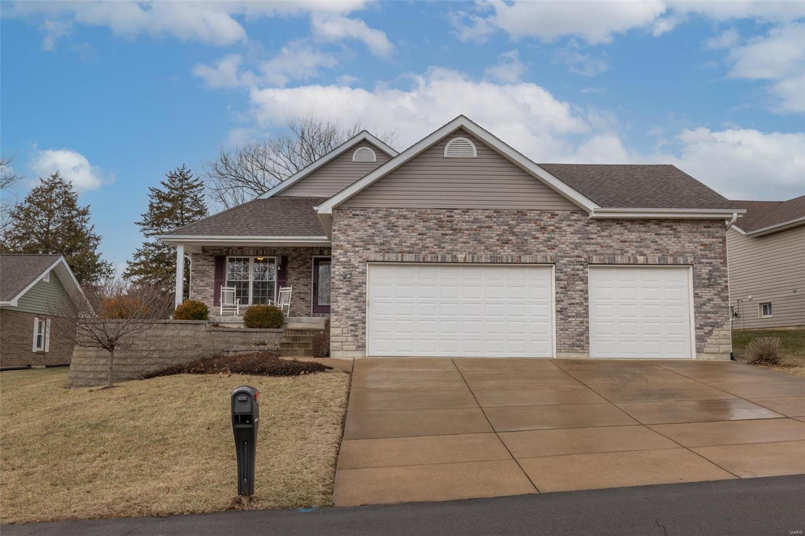 Coming soon 03/18/2022! Awesome home in an Awesome Lake Village! This home says “WELCOME TO THE PORCH”- then enter onto tons of Hickory Hardwood Floors – just inside the front door is a fabulous home office w/glass doors, gas fireplace & built-in bookcases. Follow the large wood foyer to the vaulted living area which features a beautiful kitchen with custom cabinets, breakfast room & a great room w/gas fireplace + walks out to the patio! Master has separate vanity areas, 4x3 shower, water closet & a walk-in closet that walks into the main floor laundry! You exit the laundry near the hall bath & two perfectly placed guest/kids’ rooms. What a concept – what a house! Lower level has a 23x11 family room for entertaining+17x7 Storm Room! Check out the oversized garage that has 3 bays–all different depths 20’,23’ & 26’ deep–bring the boat & the golf cart! Great lake for boating, skiing, fishing plus a village pool, playgrounds, beach, tennis, pickleball, music at the beach & access to golf!