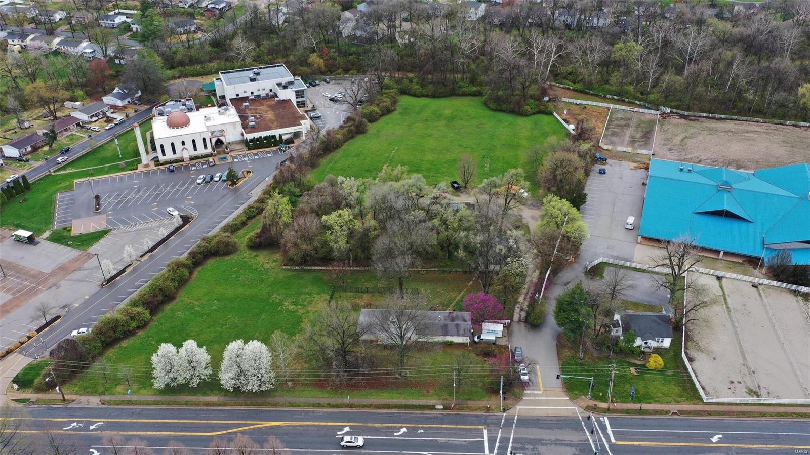 This unique and very rare piece of land has been sought after for many years with many attempts in purchasing. Here is your chance!!
5.2 Acres of Leveled Topography with a 350 ft frontage to Weidman, viewing Queeny Park. Driveway Situated at an existing 4-way stoplight. Zoned R-3, 10,000sq ft min lots. 
Existing home situated on frontage portion of the plat. Greenhouse structure and cinderblock structure sit about 1/2 way back on plat. Deeming home and structures to be a teardown as they are unusable.