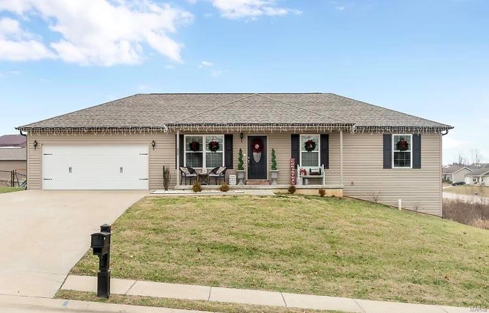 What's not to love about this updated 3 bed, 2 bath in Jackson's East Elementary school district? ALL the curb appeal and extras will greet you as you pull up to this home on a low-traffic street in the back of Savannah Ridge subdivision- black shutters, quaint front porch, and don't forget to peak around back... an awesome deck for summer nights and custom stone pavers adorn the outside patio with a cozy fire pit that will be perfect for this winter. Inside is no different- a chic' modern farmhouse style compliments the open concept living area just perfectly. You will swoon over the white kitchen cabinets and center island. Stainless steel appliances with plenty of cabinet space, plus a pantry off of the eat-in kitchen. Owners recently installed sleek vinyl plank flooring throughout the family room and hallway. Main level laundry, an oversized garage, and a walk-out basement, all on 0.7 acres. This cutie is truly move-in ready and just waiting for its new owner to call it home!
