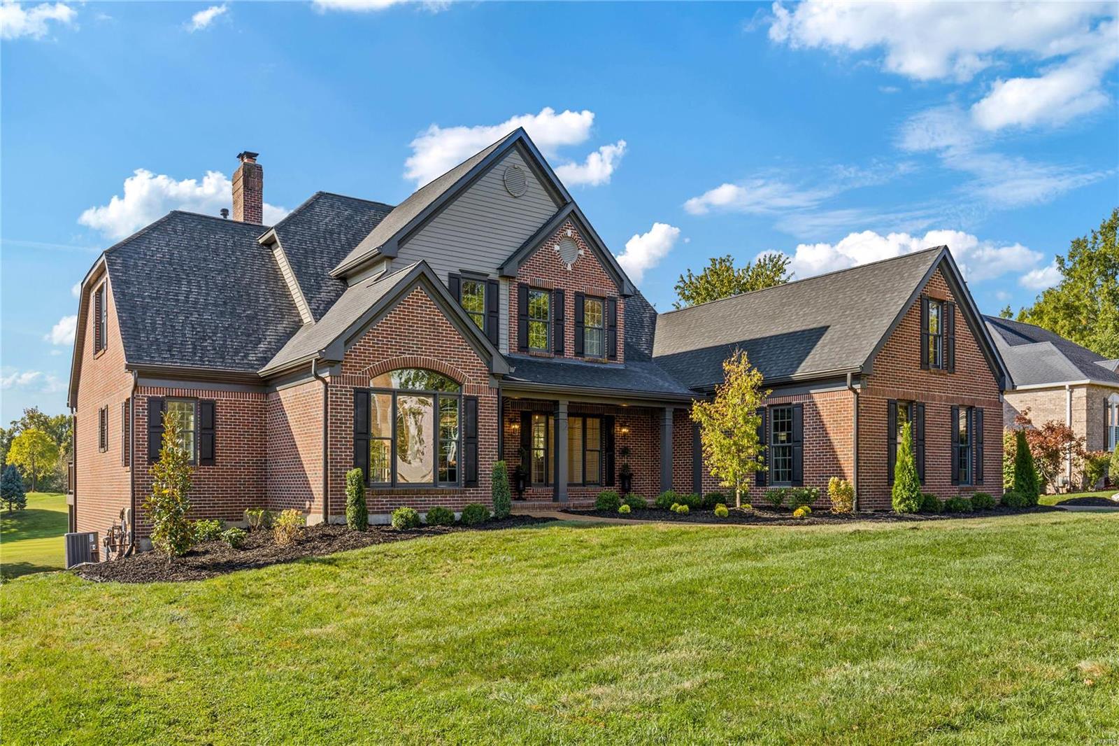 Premier renovation! This full-brick Schaeffer-built 1.5 Sty features best-in-class improvements, fixtures & amenities including wide plank white oak hardwoods, detailed trim work & designer lighting. Impressive 2-sty foyer highlighted by dramatic curved staircase leads to private study, beautifully appointed dining room & striking great room with wet bar, floor-to-ceiling brick fireplace & soaring windows that overlook the 9th hole on the North course. Beck Allen-design kitchen with white custom cabinetry, quartzite countertops, Cafe appliances & 8’ center island adjoins breakfast room with wide bay window & vaulted hearth room with fireplace. Primary bedroom suite offers an appealing retreat with marble bath with shower spa & atrium doors that open to deck. Front & rear staircases access 3 additional bedrooms, 1 with ensuite bath & 2 with Jack n’ Jill bath. Lower Level includes recreation room with wet bar, family room with stone fireplace, office, workroom, 5th bedroom & 1 ½ baths.