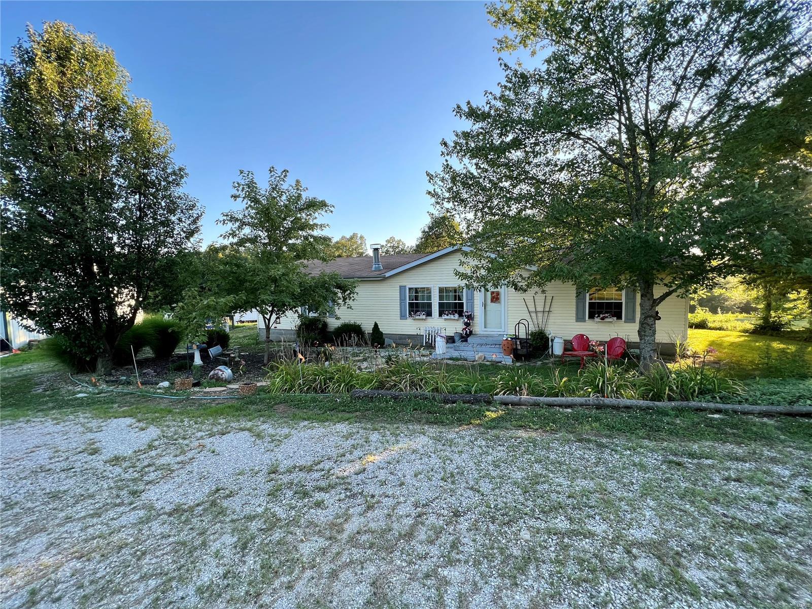 Looking for your own slice of country in northern Perry Co.? This property is it! The 1998 doublewide has a stick built family room addition that walks out to a covered patio. The above ground pool can keep you cool on hot days. 2 car detached garage has wood heat if tinkering year round is your jam. Wanna catch your dinner? You can in the pond! Chicken coop (& chickens) stay with the property. Please do not drive up to the home.