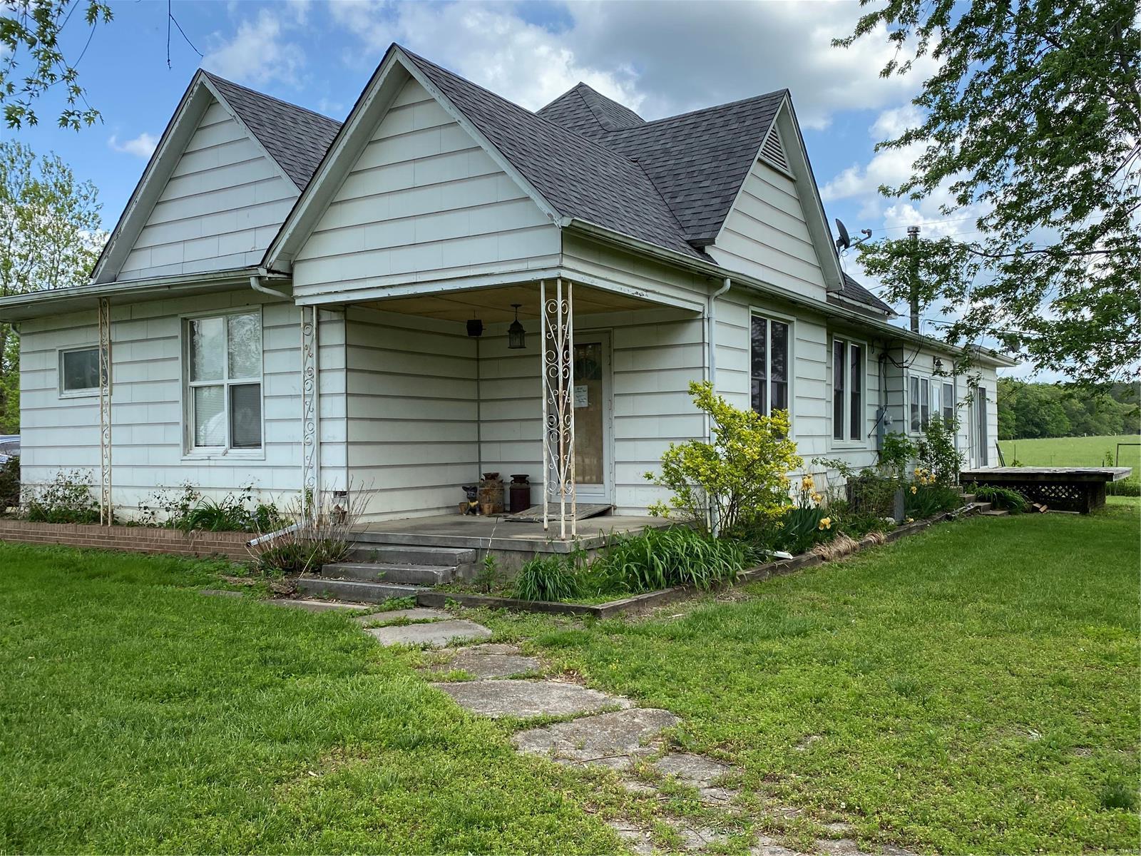This two bedroom two bath house is just minutes from The Meramec River and Onondaga Cave.  The home is all on one level, with a lot of living space.  The large eat in kitchen has plenty of counter space and additional storage.  There is a separate dining room and a large family room.  The master opens with french doors off the living room and the Jack and Jill bath is shared by the second bedroom.  The sun porch has lots of potential with an entry door to the beautiful yard with mature trees and lots of shade.  The detached two car garage is not far from the house with a sidewalk that connects both structures.  The garage has a workshop area and appliances that will remain.  The 16' x 8' utility shed has a doggie door and is located next to the perfect garden spot.  The property is completely fenced and has a large iron gate at the entry.  This property has lots to offer and is priced right!  Come take a look for yourself. Additional Rooms: Sun Room