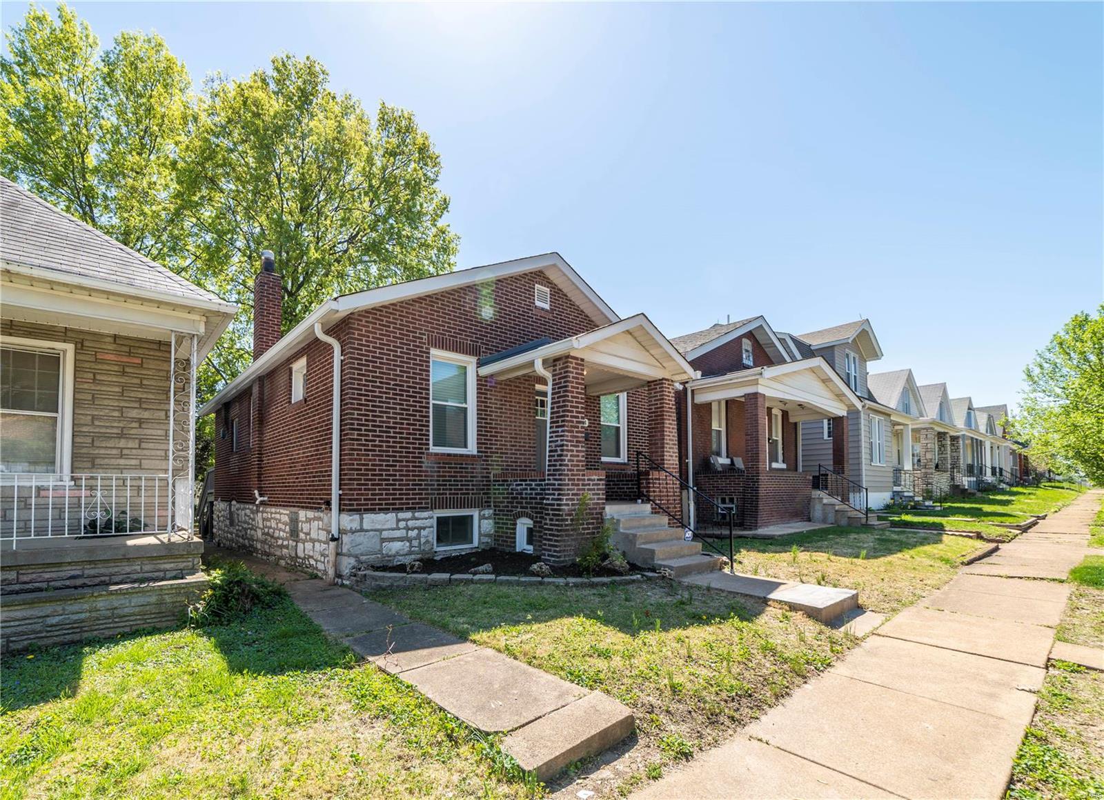 Back on the market, buyer could not obtain financing. Must see this remodeled charming brick bungalow  located on one way street in South St Louis City neighborhood. Main level offers spacious living room with decorative fireplace and recessed lighting, large eat in kitchen with new gray color cabinets, solid surface counter tops, mosaic tile back-splash, recessed lighting and stainless steel appliances, nice size family room featuring wood burning fireplace and decorative ceiling beams, 2 bedrooms and beautiful all new ceramic tile bathroom. Partially finished lower level features 2 finished rooms perfect for office or your hobby room, full bathroom plus extra storage/workshop room.  Walk up to nice size flat back yard. New electrical service, lot of new drywall, all new flooring, new entry door, new lighting fixtures, fresh paint, and list goes on. Seller is providing 1 year home protection plan for buyer's peace of mind.