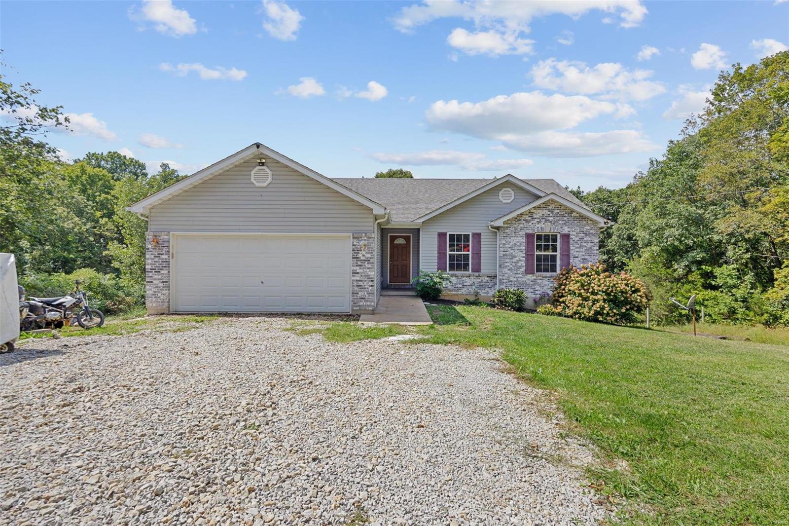 This 3 bed 2 bath is surrounded by woods and is truly a paradise in the country. Located off a main road, very convenient to Hwy 21. Enjoy a large living room with an open floor plan, fireplace, newer flooring and vaulted ceilings. Kitchen/dining room is open to the living room and features a large composite deck off the dining room.  Home features a full walk out basement with plenty of storage. Truly a gem and turn key ready, this home will not disappoint and is awaiting a new home owner.