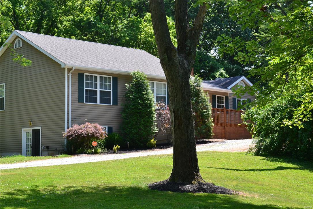 Beautiful walk out ranch on approx. 2.5 acres in a country setting! Watch out for deer! Appr. 2700 square feet. 4 bedrooms, 2 full & 2 1/5 baths, 2 car o/s detached garage, wrap around deck with built-in hot tub! Stamped patio, awesome kitchen boast solid surface (silestone) countertop, custom cabinets, stainless steel appliances built-in oven & microwave, 2 built-in trash cans, downdraft stovetop in huge center island, ceramic backsplash, huge pantry. Breakfast rm with built-in wine cooler French doors to deck, Main floor laundry, Vaulted master bedrm with walk-in closet & full bath. Partly finished w/o lower level with huge family room with recessed lighting, kid’s playroom / office, spacious walk-in closet, bedm, huge storage area, 1/2 bath and French doors to patio Zoned heating and cooling, (Existing home renovated and new addition added on with 3 bedrooms, 2.5 baths, w/o LL under new addition in 2006 & 2007)