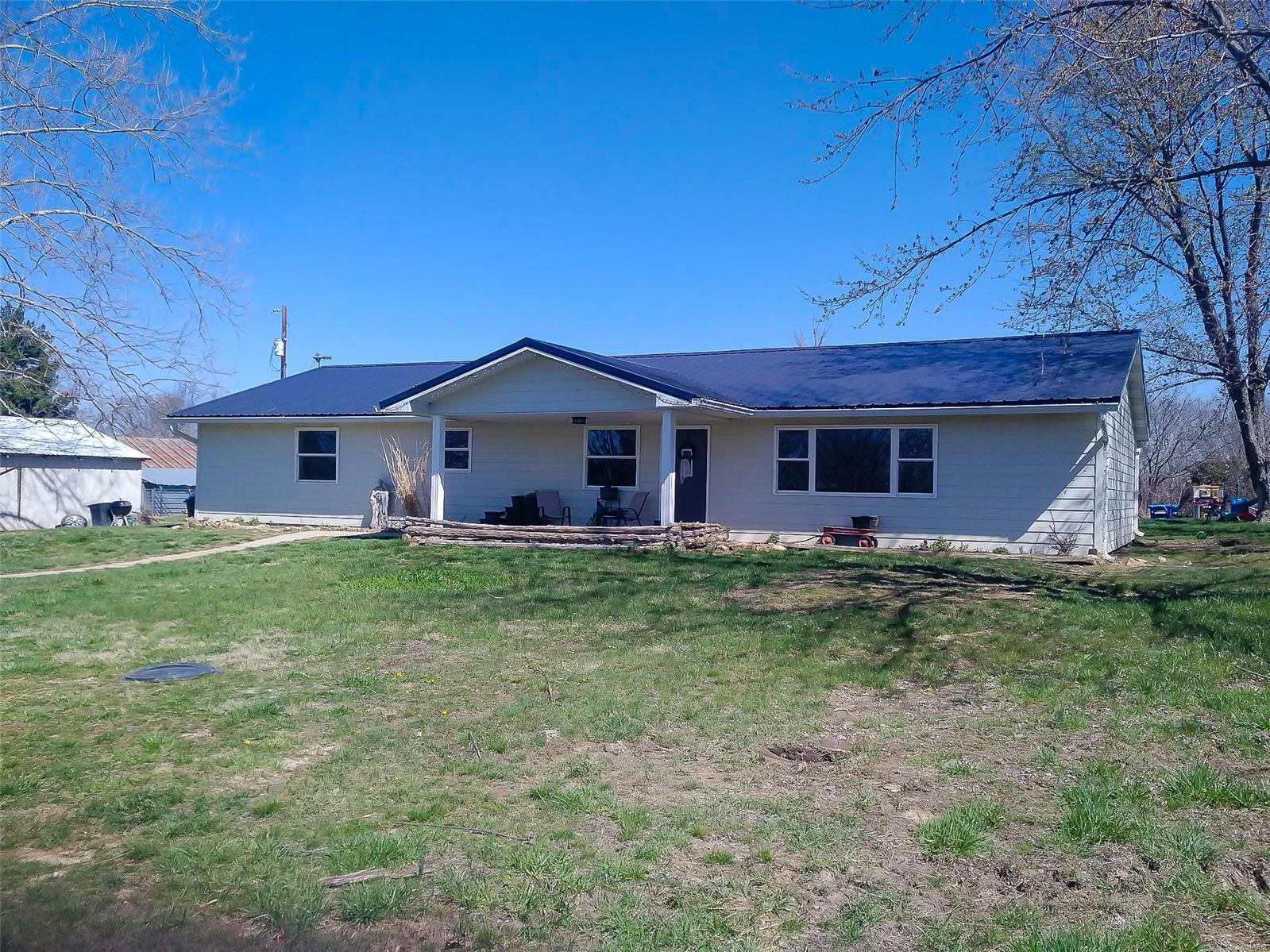 Check out this nice home on nearly 5 peaceful acres. This recently updated home features 4 bedrooms, 2 full baths, an open floor plan, a farmhouse style kitchen with quartz countertops and a center island, a master bath with jetted tub and much more. Sellers have done a lot to this home besides cosmetics, including newer furnace, roof, siding, windows, septic, pressure tank and plumbing.  For outdoor advantages, there is a 1 car detached garage with workshop area and a pole barn. Also, some fencing that would be perfect for a few animals. Enjoy the cherries and pears from your very own fruit trees!