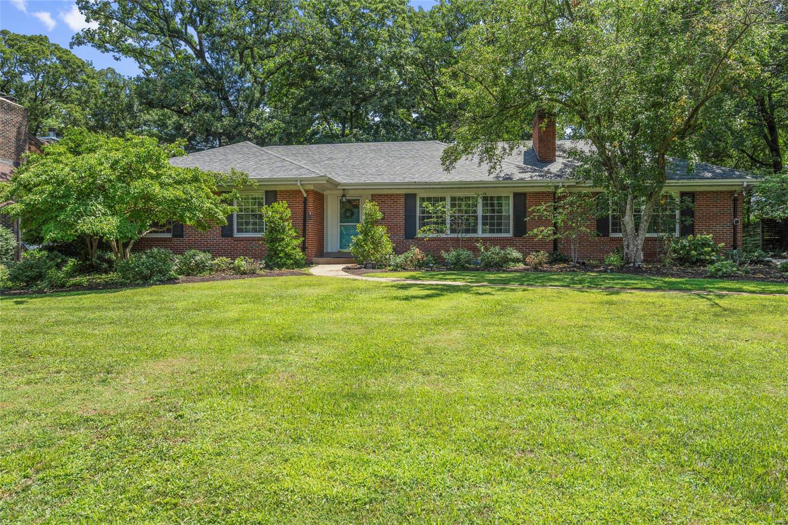 Located in the much desired Sherwood Forest in Webster Groves, this beautiful ranch home offers excellent curb appeal with level yard, brick elevation, 2 car garage sitting on nearly half an acre! As you enter this home you are greeted with hardwood flooring & neutral paint through out. The formal living room offers a gas fireplace & plenty of natural light with a wall of windows. Just off the formal living room you will find a den complete with gas fireplace! The update kitchen features tile flooring, white cabinetry, butcher block wood counters, stainless steel appliances, & complimenting white subway tile back splash! The spacious sun room offers tons of windows as well as convenient access to the park like backyard complete with deck & gas fire pit area! The master suite is spacious with adjoining updated master bath! 2 additional bedrooms & a 2nd full updated bath complete the main floor. Additional living space can be found in the clean walk out lower level with half bath!