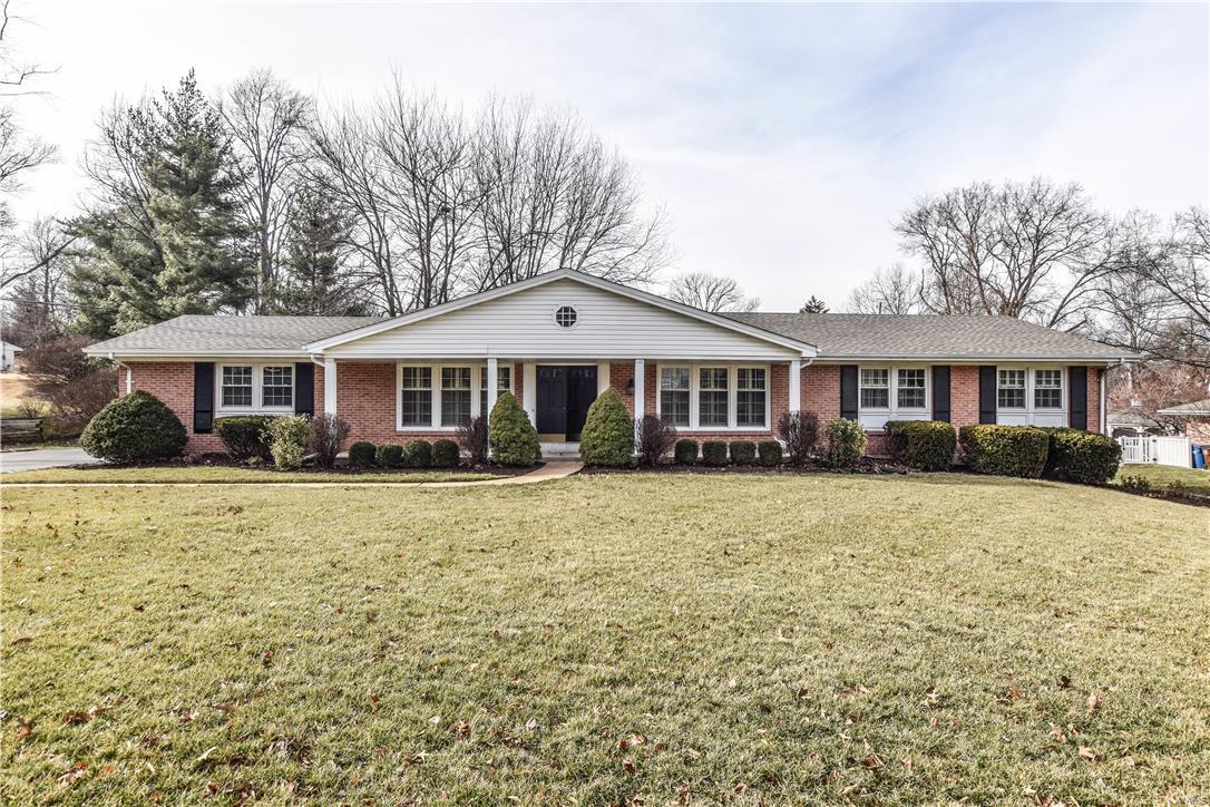 Meticulously maintained brick single story Colonial in award winning Ladue Schools. Step inside to the gracious dining & living room with built in bookcases and plantation shutters. Hardwood flooring & Low-E thermal windows throughout. Relax in the spacious family room with fireplace or step through the french doors to the new patio with extensive landscaping. The kitchen boasts granite counters, Thermador appliances, instant hot water, planning desk and breakfast area. The generous Master bedroom includes double closets, built-ins & a remodeled bath. Two more large bedrooms with ample closet space.An additional remodeled bath with Jacuzzi tub and double sinks. Take a tour around the expansive walk-out finished lower level with massive living space, bath and an extra office/hobby room.This basement has an incredible amount of storage space including very generous walk-in cedar closets.The in-ground sprinkler system keeps the roses, gardens & lawn looking beautiful.This one is a beauty!