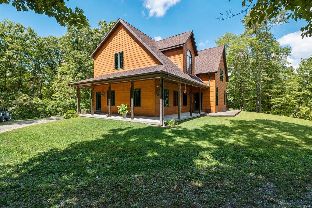 The Missouri Ozarks is home to some of the most beautiful property in the Show-Me-State. 158+/- acres in the heart of Douglas County is a gem in this gorgeous region. Enter the property from a paved road & at the end of a winding driveway you find the 4900+/- SF home perfectly situated for relaxing, country living. The rustic exterior and landscaping fit ideally w/the surroundings. Immaculate 1½ story home has 3 BR w/1 more potential BR now used as a sewing room, 2½ baths, perfectly laid out kitchen w/massive island w/stove top, gorgeous family room, wrap around porch & 4 car garage. The land surrounding this country estate adds to the allure of this offering. Of 158+/- acres, roughly 30+/- acres is open pasture; balance is in mature, hardwood timber. Open areas are ideal for cattle or horses & would be nice food plot locations.  Deer population is off the charts & last year a 164” giant was harvested off the neighbor’s property-rumor has it the bruiser strolled out of this timber!
