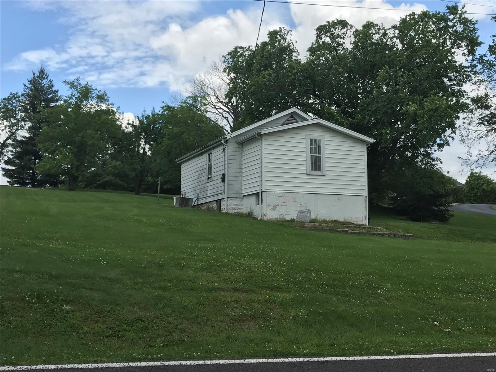 One half acre prime lot with small house ready for renovation or tear down.  Dead-end street, convenient location close to medical facilities, highways, recreation, and restaurants. Property being sold as-is, Special Sale Contract only. Sewer easement available. Great opportunity for quality home site in redeveloping desirable area.