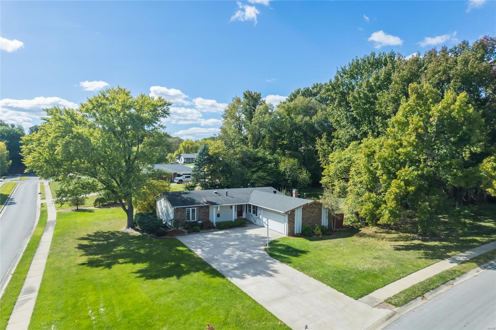 This beautiful 3-BRM, 3-BATH Ranch offers the perfect blend of comfort and style. Fresh Paint Throughout Main and Lower Level Dec '24! PLUS NEW Carpet in Lower Level '24, Main Level Carpet only 5 Years old. Main Level boasts: Living Room - Dining Area Combo, Family Room with a cozy, Full Masonry, wood-burning fireplace, a Sun-room (offering a peaceful retreat to enjoy your morning coffee) Kitchen featuring ample cabinetry & granite counter space (making meal preparation a breeze),  Primary Bedroom w/ Full Bath (double sink vanity). 2 Additional Bedrooms & a Full Hall Bath! BONUS, spacious, Partially Finished lower level includes a Huge Rec Room, numerous storage areas, & an Office (or 4th BRM) with another Full Bath! With the oversized 2 car garage, you'll have plenty of space for vehicles & storage. HVAC 9 Years Old. 200amp electric Panel. Nestled on a spacious half-acre corner lot. Additional Rooms: Sun Room