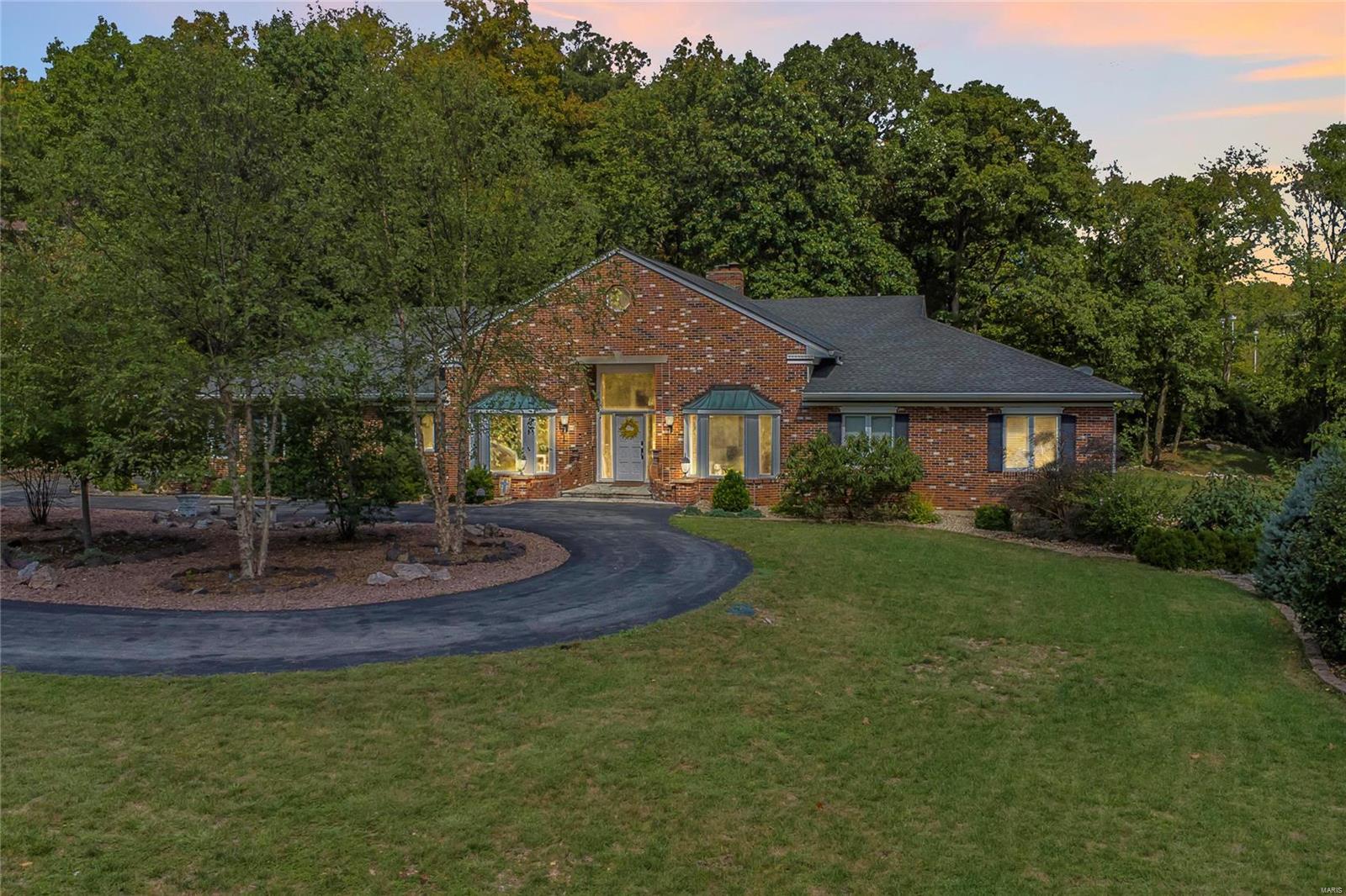 Custom built, all brick ranch home on a beautiful 1.27-acre lot, with mature trees, in the private, gated Hickory Woods Subdivision, the heart of Town and Country! Top-Rated Parkway West – Mason Ridge Elementary! This 4 Bedroom, 7 Bath (4 Full / 3 Half) home with over 7,600 Sqft of living space, has been freshly painted, in stylish neutral colors, to show off its architectural details. From the moment you walk into the Foyer, you will appreciate the open floor plan this home offers, and know you are home! Additional features include: gorgeous Great Room, gourmet eat-in Kitchen, spectacular Main Floor Master Retreat, professionally finished walkout Lower Level, beautiful hardwood floors, 2-zoned HVAC, a circle drive, an oversized (heated and cooled) side entry 3-car garage with 16’ ceilings, and professional landscaping - just to name a few! Relax outside in your private park-like setting, on one of the expansive decks, by the stone fire pit, or take a stroll through the neighborhood.