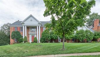 Spectacular Brick 2 Story Home on Beautiful 1/2 Acre Lot.  Impressive Two Story Entry Foyer, Formal Living Room with Dentil Molding, Formal Dining Room with Coffered Ceiling, Wainscoting and Dentil Molding.  Great Room Boast 5 Bay Window, Woodburning Fireplace, Wet Bar, French Doors to Patio.  Marble Flooring in Entry Foyer, Living, Dining & Great Rooms.  The Spacious Kitchen Offers Granite Counters, Breakfast Bar, Walk in Pantry, Planning Desk and Huge Breakfast Room with 3 Bay Walk Out to Patio.  First Floor Laundry and 1/2 Bath Complete the 1st Floor.  Upstairs You'll Find the Large Master Bedroom Suite with Coffered Ceiling, Walk in Closet, Master Bath with Separate Tub & Shower, Double Bowl Vanity and Skylight, and 3 Additional Spacious Bedrooms.  The Basement is Just Waiting for Your Finishing Touches, but is Complete with a Full Kitchen.  Beautiful Lot with Tons of Privacy, 3 Car Rear Entry Garage and So Much More.