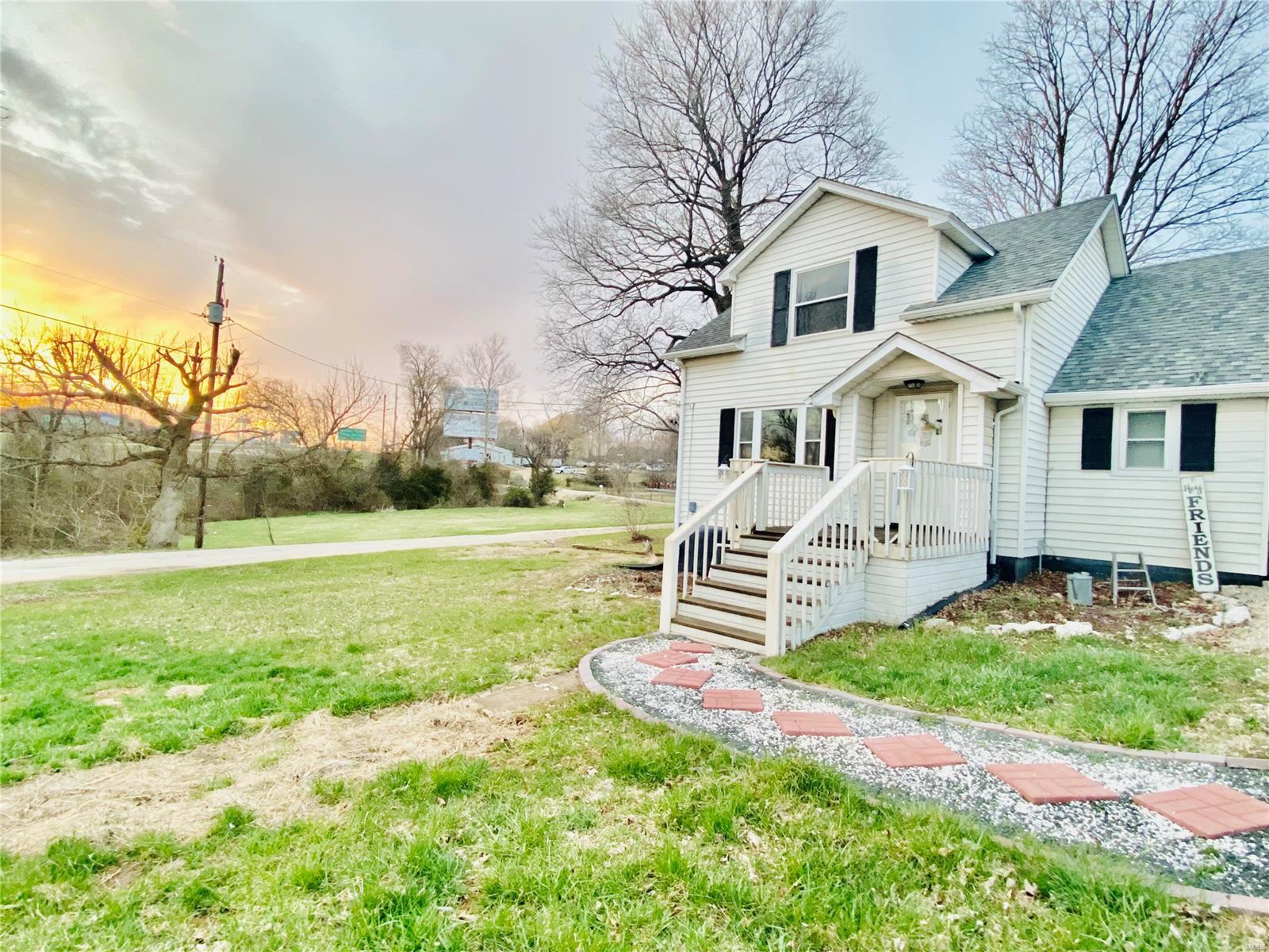 Beautiful 2 bed 1 bath R1 School District home on 4+ acres with Hwy 67 frontage.  Enter home from the new front porch to the farmhouse appeal with new laminate flooring in all rooms + hardwood in the main bedroom. Walk out of the galley kitchen to the large breezeway made for relaxing, to the 3-car oversized garage with workbench area & plumbed for a bathroom.  Across from the house is a detached machine shop/workshop garage with a concrete floor and overhang to use as an entertainment space. Property has started to be cleared & great for a mini farm or multiple business opportunities.  Springtime will bring many flowers as this property has a park like setting on a beautiful flat lot.  The possibilities are really endless with this listing!!!!  Make your appointment today!