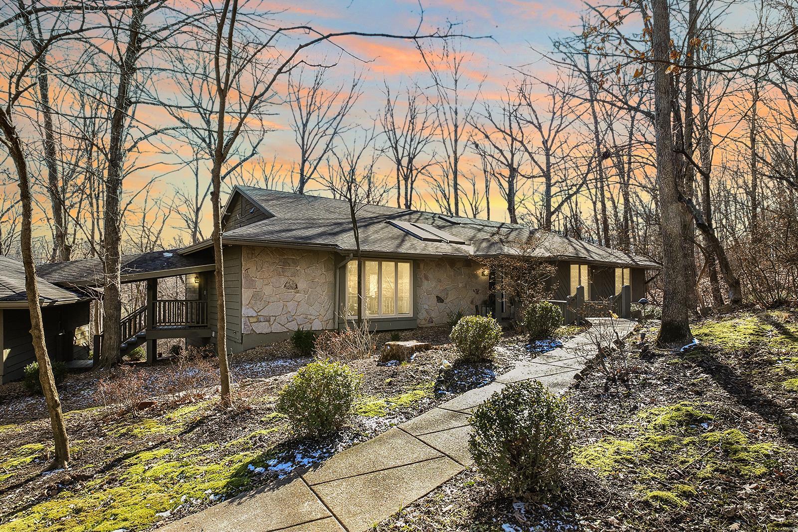 Exquisitely renovated, 3 Bedroom, 3 Bath ranch situated on a 3-acre, cul-de-sac lot, boasts over 3,700 Sqft, including the Lower Level! The living space has vaulted ceilings, hardwood floors and stunning finishes. No detail was overlooked! Kitchen features a massive center island, Bertazzoni range, quartz countertops and walk-in pantry. Dining Room with a beautiful custom wine storage and large fireplace with custom surround. Two doors lead to the screened porch and deck with gorgeous lake views! Primary Suite offers a spacious sleeping area, large walk-in and reach-in closets, plus en suite Bath with dual sinks, freestanding soaking tub and dual walk-in shower. Two additional Bedrooms and a full Bath complete the sleeping quarters. Walkout Lower Level includes a custom bar, Rec Room, sleeping area/Office, full Bath, and access to the Lower Level deck! Enjoy use of the subdivision's 3 lakes and secluded lifestyle, yet minutes to Chesterfield Valley. Award-winning Rockwood Schools!