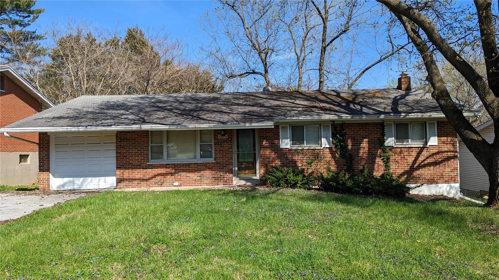 This charming brick home presents a great opportunity for someone seeking a comfortable and convenient living space. Boasting a one-car garage, and hardwood floors, it has plenty of character to offer. The oak cabinets in the kitchen add a touch of elegance and functionality to the space. A spacious living/dining combo offers plenty of room to entertain guests or relax. The private fenced backyard provides a perfect setting for outdoor activities, while the finished walkout basement with a full bathroom offers additional living space. A little love can go a long way in transforming this house into your dream home or an excellent rental for your investment portfolio. Don't miss out on the opportunity to make this dollhouse yours. Contact your realtor or us to find out how to place a bid on this fantastic house.