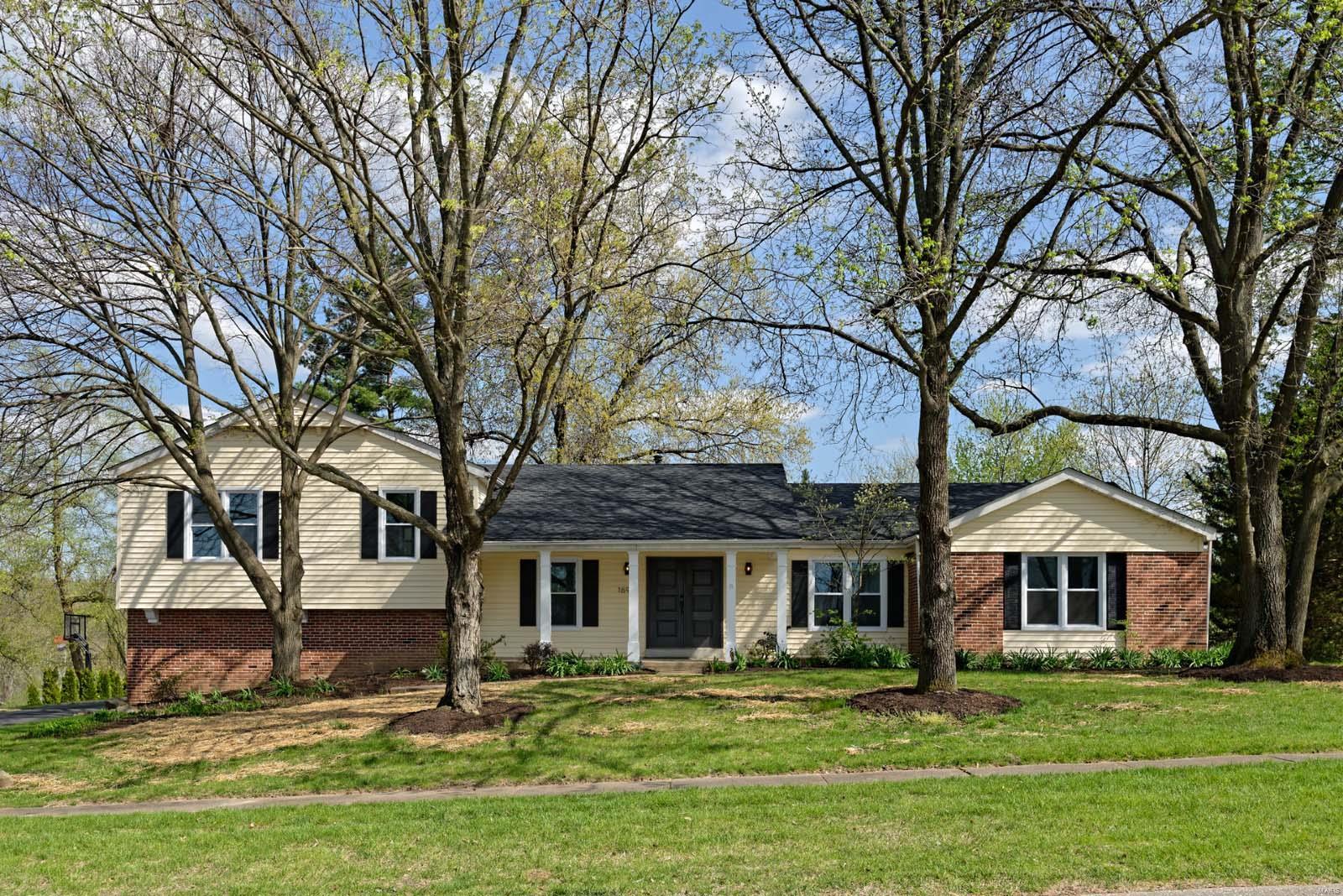 One of a kind home located in the desirable Claymont Woods neighborhood. It has a unique divided floor plan that has been cosmetically renovated to today's expectations. The chevron tiled entryway opens to a formal living & dining room. Refinished hardwood floors & vaulted ceilings guide you into the large family room. Equipped with a wet bar & wood burning fireplace, the family room opens to the eat-in kitchen. The gorgeous kitchen showcases custom white shaker cabinets, custom crown molding, onyx counters, marble backsplash, & stainless appliances. The master suite has a walk-in closet, private bathroom with double bowl vanity & a stand-up shower. The 2nd bedroom & 1/2 bathroom rounds out the first level. The remaining 3 bedrooms & full bathroom are located on the 2nd floor. Downstairs you'll find a finished lower level, laundry room, & full bathroom. Other features include: new roof, vinyl windows, new interior doors, concrete patio, and 2 car garage. Broker is owner.