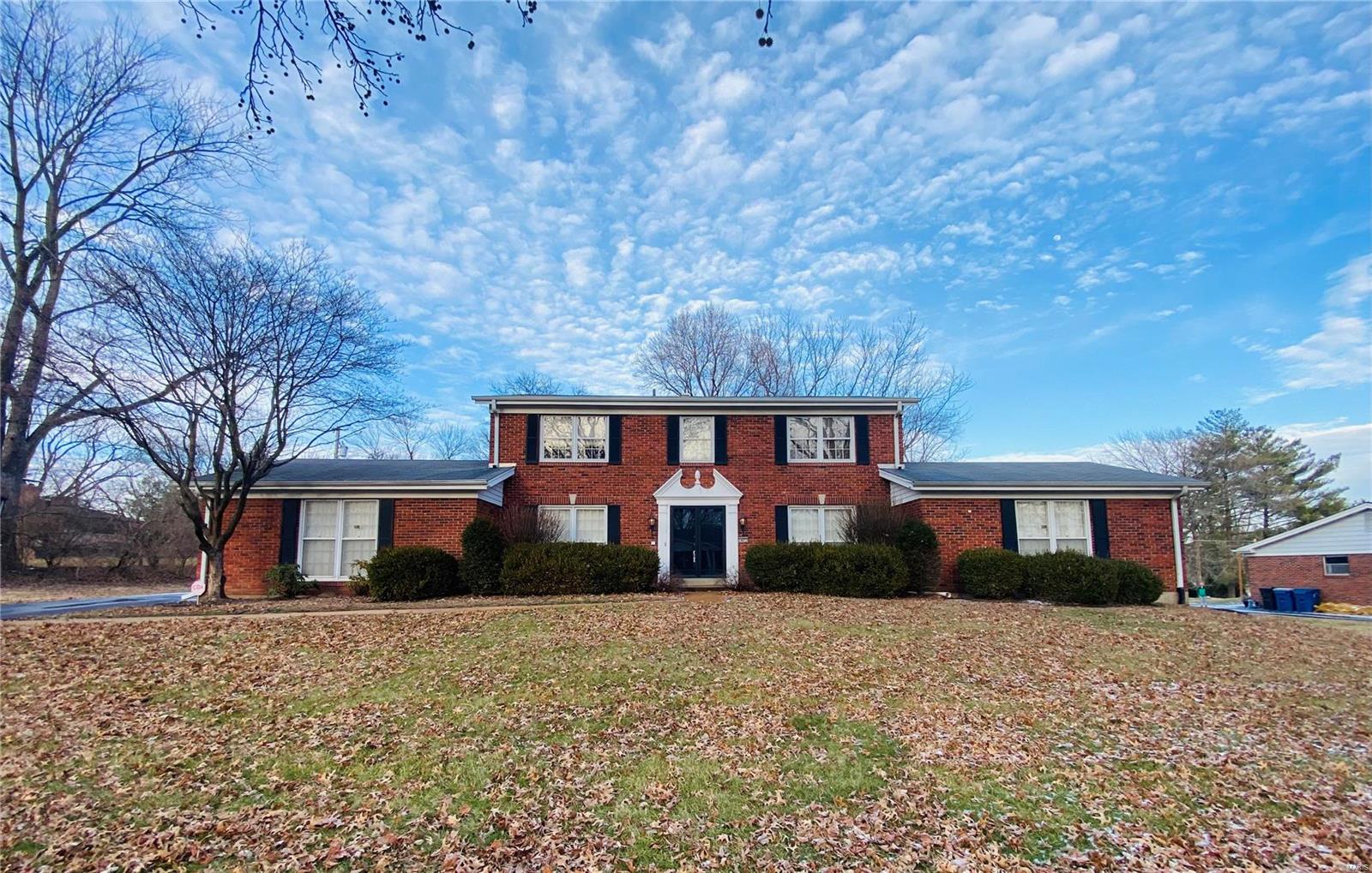 4 bed, 2.5 bath, 2 story brick home with 2604 sq. feet of living space. Located in desirable Ladue Trails subdivision, Parkway school district. Entry foyer opens to dining room. Kitchen has white cabinets, ceramic tile back splash, electric cook top & double oven. Breakfast room features large picture window, ceiling fan with light & atrium door leading to backyard. Half bath located off main hallway to family room. Spacious family room has parquet flooring, gas fireplace, wet bar & card room. Sunken formal living room has additional space for entertaining. Upper level master bedroom with en suite bath. Master bedroom has carpeting & ceiling fan with light. En suite bath has ceramic tile flooring & step in shower. Bedroom 2 has hardwood flooring & ceiling fan with light. Hall bath with ceramic tile flooring & shower/tub combo. Bedroom 3 has carpeting & ceiling fan with light. Bedroom 4 boasts hardwood flooring & ceiling fan with light. Unfinished lower level. Home is on 0.57 acre lot.