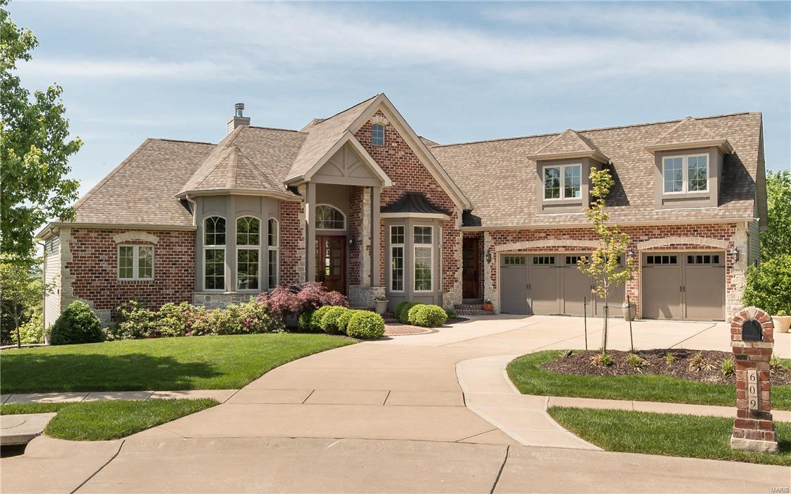 Spectacular brick & stone 1.5 Sty! Over 7000 sf of living space enhanced by gleaming wood floors, extensive millwork, 11' ceilings & walls of windows with unsurpassed views. Dramatic barrel-vaulted foyer leads to private study, elegant dining room with architectural columns & spacious great room highlighted by stone fireplace.  Designer kitchen with granite countertops, custom cabinetry, professional quality appliances & 8 center island adjoins light-filled breakfast room & coffered hearth room with floor-to -ceiling stone fireplace Sumptuous master bedroom suite with wide bay window & lavish bath w/shower spa offers an appealing retreat. Broad atrium staircase leads to 3 additional bedrooms, 1 with ensuite bath & 2 with Jack n' Jill bath, plus recreation room w/fireplace & wet bar. Additional apartment w/private entrance & elevator access (all 3 fls) features great room, kitchen, bedroom, full bath & laundry. Situated on premium cul-de-sac lot with deck, pool, hot tub & 3-car garage.