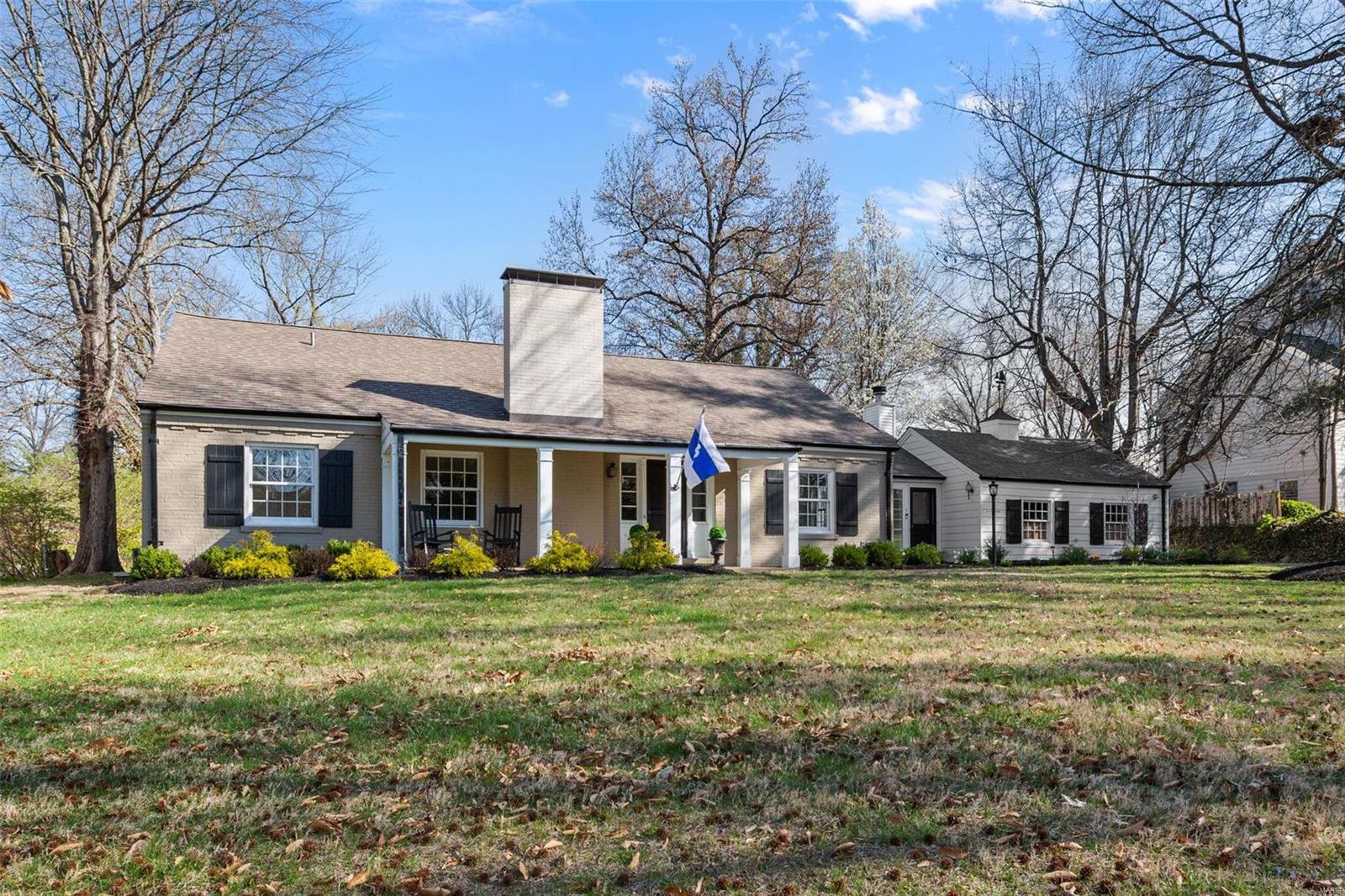 This is a picture-perfect home in a neighborhood long-sought-after for its beauty and location.  The covered porch invites you into a handsome living and dining area, perfect for gatherings.  From there, be prepared to find wonderful features around every corner.  Retreat to the primary bedroom, with expansive views, complimented by a generous walk-in closet and full bath, aside another bedroom ideal for nursery or office.  The breathtaking kitchen/family room, with bright cathedral ceilings, is flooded in light from skylights and stunning window-wall views.  Upstairs, you’ll discover two generous bedrooms, a hall bath, and ample storage…while the partially-finished lower level offers tons of possibilities and more storage.  The picturesque patio leads to a tranquil pool area.  With first floor laundry, three wood-burning fireplaces and attached two-car garage, this property has been thoughtfully designed and maintained to allow you to move in and start enjoying your lovely Ladue home!