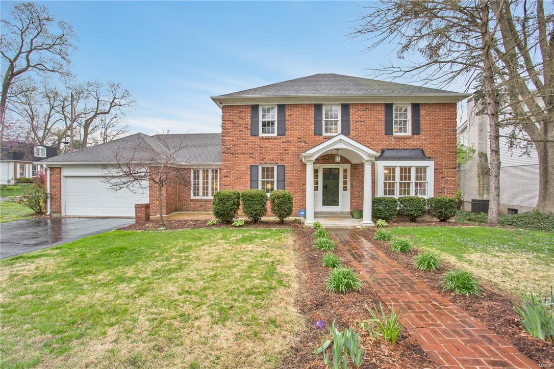 Fantastic 5-bedroom 4-bath brick 2-story in Ladue schools with nice bright open floor plan. Updated kitchen and bathrooms. Two master suites: one on the main floor and one upstairs. There is also a main floor laundry room off the kitchen, large finished lower level with great rec room, wet bar and full bath. Charming screened in porch with views of the large corner lot. Steps from Crystal Lake Park playground. All of this plus an attached two car garage. Don't miss your chance!!!