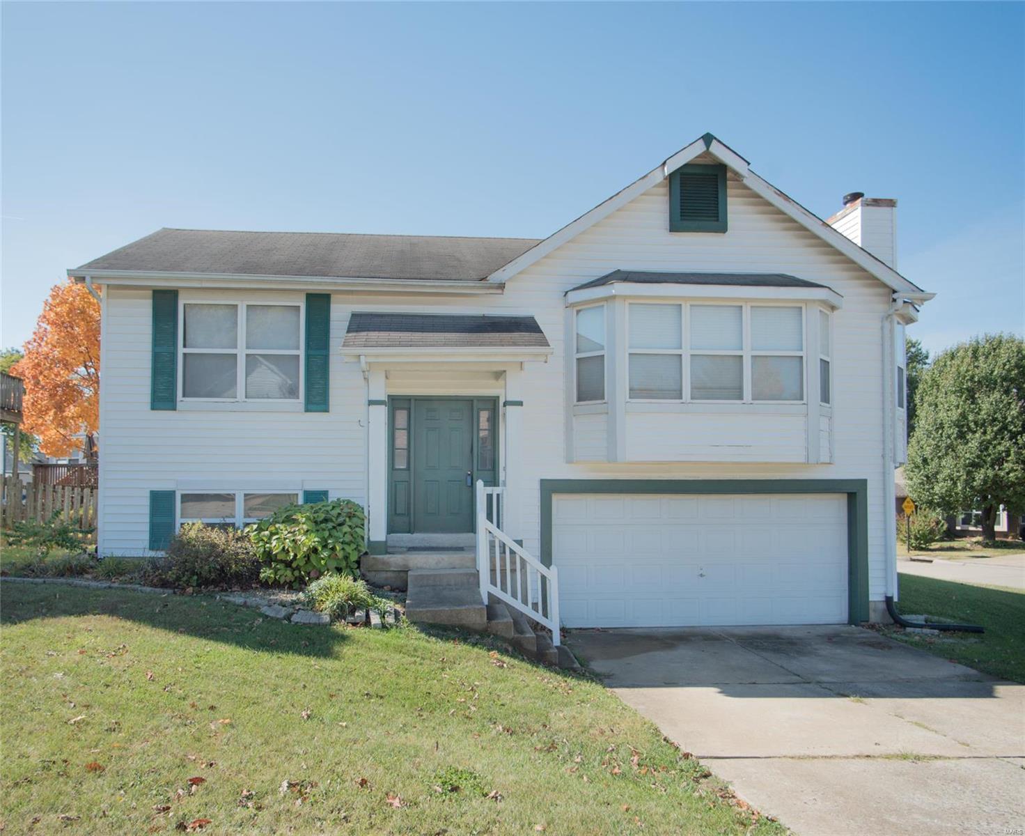 This Former Display Home sits on Corner Lot & is loaded with Builder Upgrades including Vaulted Ceilings & Plant Shelves, Woodburning Fireplace, 3 Bay Windows letting in the beautiful natural light in. Open Floor Plan, Large Great Rm, Breakfast Rm Slider Door to Large Deck, Spacious Kitchen w Breakfast Bar. New Countertops & New SS Appliances New '20. Updated fixtures. 6 Panel Doors. Split bedroom plan, 2 Beds, 1 Bath Upstairs. Huge Master. 3rd Bed & additional Full Bath and Rec Rm in LL. Oversized 2 Car Garage.w space for Workshop. Fresh Paint. Upgraded 50 Gal Water Heater. Water Softener. Walk to dining, shopping, etc. Less than a Mile to HWY 70. EZ Access to HWY 364. Less than 10 Minutes to HWY 40.
