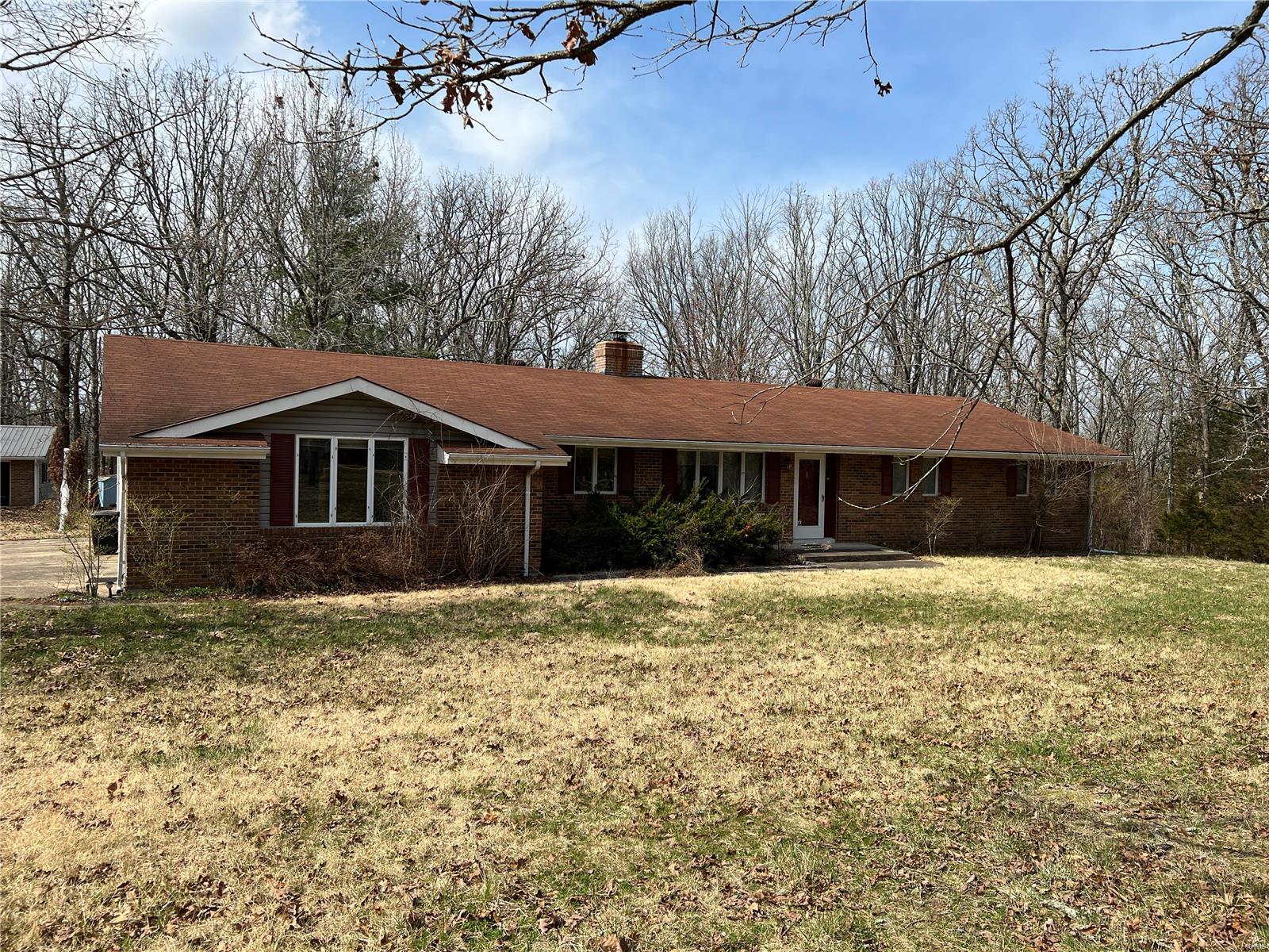 WELL-MAINTAINED HOME ON GREAT LOT, CLOSE TO TOWN! This great home boasts a spacious living area with large kitchen/dining room combo and lots of storage. The french doors provide great views of the large covered patio and wooded backyard. This home is located in a wooded neighborhood just minutes from downtown Rolla. 3 bedrooms and 2.5 bathrooms in just under 1,800 square feet of living space and includes a generous two-car attached garage with half bath. There is a great workshop in the backyard just perfect for working on your latest project and includes plenty of storage for the lawnmower, bicycles, you name it. You don't want to miss this opportunity to own a piece of relaxing country life close to town. Text or call today before it's gone!