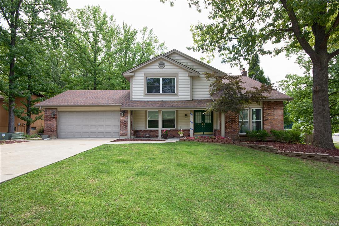 Nothing small about this home- 2,800 sq ft 2 story home, with oversize 2 car garage located on .57 acre fenced in lot, backs to trees & convenient location close to Page/364 extension. As you enter the home,you will find a large living rm w/ vaulted ceiling & spacious dining rm w/ crown molding & large windows for the natural light. The main floor has a family rm w/ wet bar & fireplace, a large rec rm w/ built in cabinetry & a spacious eat in kitchen & 1/2 bath. Main floor laundry room & w/d hook ups in basement. Upstairs the master suite has his & her closets & bath. On the second floor, you will find 3 additional bedrooms and another full bath. Lower level is unfinished but awaits tremendous possibilities with a rough-in for a 4th bath,an additional laundry hook up with a walk out. Enjoy entertaining family & friends this fall in the fenced backyard that backs to trees.  Seller is motivated & willing to pay some closing costs. Schedule your showing today!