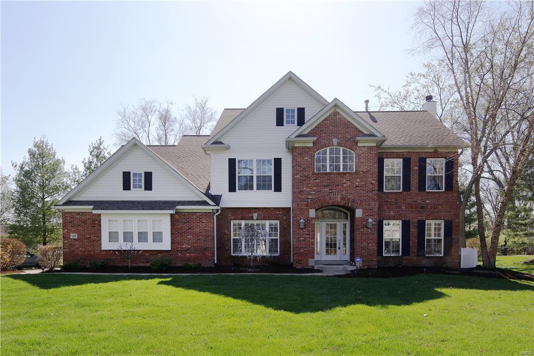 New Price! This expansive & gracious 2 story home has all the amenities today's buyer is seeking. Gourmet kitchen w butlers pantry, planning desk, granite counters, center island w seating & stainless steel appliances opens to the family rm w gas fireplace and built in bookcases. Bay window expand the kitchen eating area & overlooks the private, fully fenced, backyard. Formal living rm/study has french drs, arched doorways and easily flows from the entry and family rm.  Wainscoting & extensive millwork can be found in the dining rm & study.  Beautiful hardwood floors & 9 ft ceilings are found throughout the 1st & 2nd flrs. Take your pick of two master suites both w a luxury bath- double vanity, separate jet tub & over sized shower, and a walk in closet.  Two additional bedrms (one ensuite) complete the 2nd flr.  The media rm in the lower level has stadium seating. Fitness rm w mirrored walls, additional sleeping area, full bath, playroom & storage area.  3 car garage w epoxy floor.