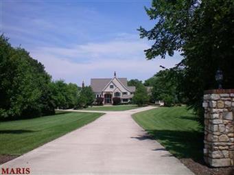 Sellers will contribute $50,000 at closing for buyer's closing costs, prepaids, and decorating upgrades with an acceptable offer.  Situated on a long lane at the end of a cul-de-sac, this exquisite home is nestled on a lavishly landscaped acreage in the heart of Hannibal and is truly breathtaking.  Upon entering the large front foyer, you feel welcomed by the expansive rooms. Beautiful views of the grounds may be enjoyed from all areas.  The main level master suite features a sitting area, large master bath with 2 walk in closets, bonus area and a spiral staircase to the lower level.  Each floor hosts its own laundry room.  The gourmet kitchen makes entertaining easy and fun.  Relax on the covered veranda overlooking  the grounds and the 50 x 20 heated in-ground pool with separate hot tub.  There is ample garage space for six vehicles.  This property has it all.  Call today for your private tour.