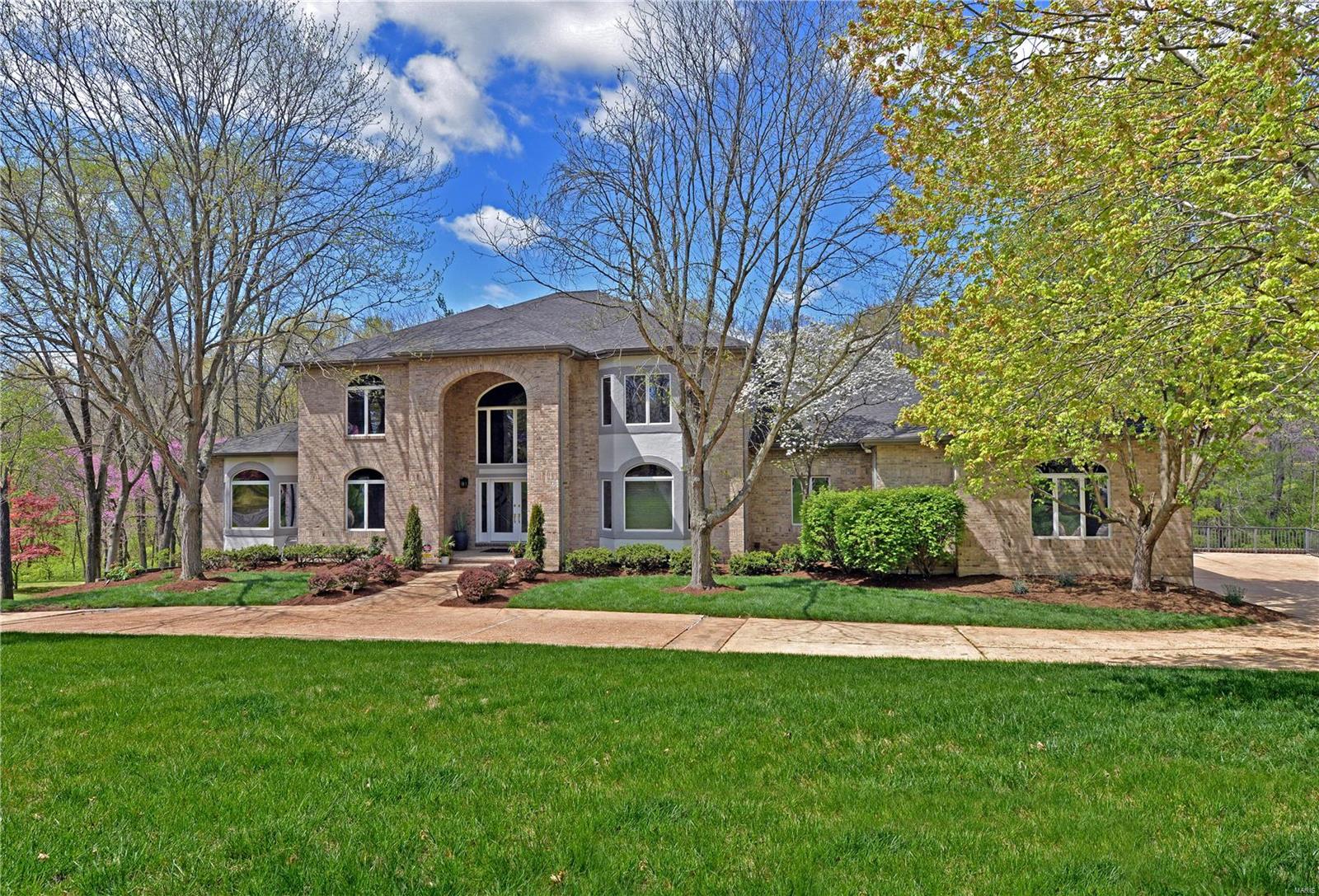 Definitely one of the most Beautiful Homes & Lot in Kirkwood! Experience craftsmanship & contemporary design in this custom atrium 1.5 story. Enter thru gorgeous double leaded glass doors into the 2 story Foyer w/marble flooring. The large Dining Rm includes tray ceiling & peek out the arched palladium window from the sunken Sitting Rm. Walk thru pocket door to a Bedrm or Office w/wood flooring. U will fall in love w/the 2 story Great Rm featuring Gas Firepl & arched windows w/breathtaking views of Pool & Backyard. The newer Kitchen, has quartz countertops, flat panel cabinets & stainless appl. Enjoy ur meals in the Breakfast Rm open to the Hearth Rm. Floor to ceiling windows offer views of the private backyard. Just steps away W/O to the screened-in Porch & Deck. You will relax in ur Master Bedrm retreat w/door leading to the balcony overlooking the Pool. Unbelievable is the word for the W/O LL, including Rec Rm, Media Rm, Exercise Rm, Hot Tub Rm, Sauna, Wet Steam Shower & HUGE BAR!