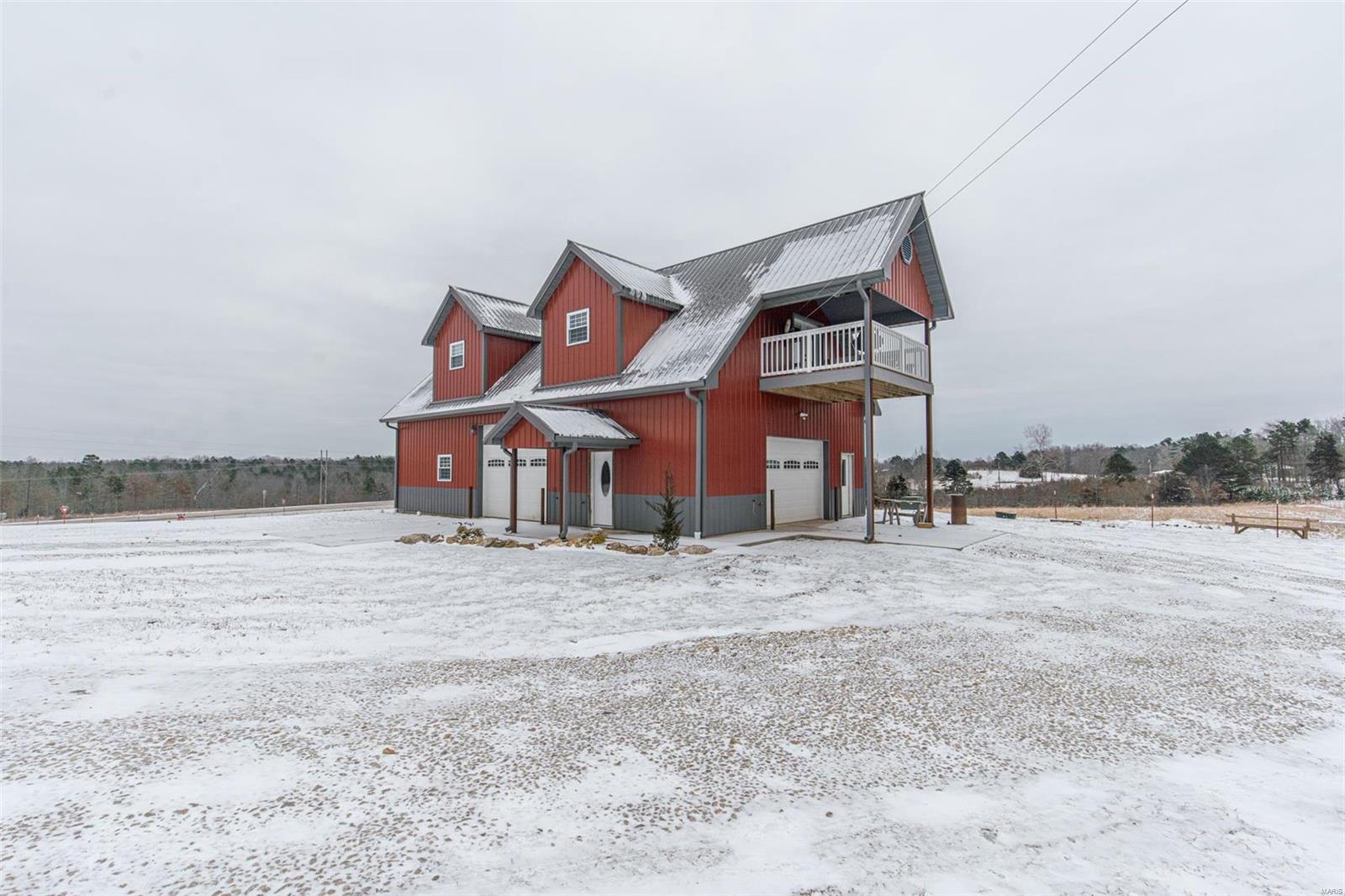 Check out this 30x50 shop with full living quarters on top located Northwest of Poplar Bluff right off HWY 60. Sits on 20 acres M/L of land and is fully foam insulated. It has 2 bedrooms, 2 bathrooms and plenty of storage for your vehicles and extras.