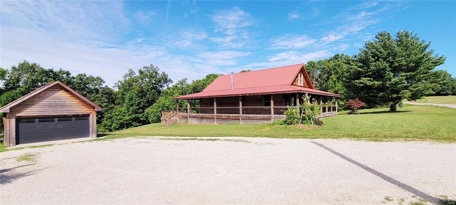Honey stop the car! This cute rustic style farmhouse has 2 beds, 2 baths, a FULL WRAP AROUND PORCH on 2.65 ac & is ready for you to start your HOMESTEAD! Private septic/well, 18x22 DETACHED SHOP w/attic storage & tree lined back yard! This home was built in 1940, but you'll see how nicely it's been updated throughout. Do you desire country living, but you need to commute to work? This charming home is Located just off Hwy 94, so it's only about 20 mins to hwy 70. The main floor has the living room, dining, mud/sun-room, kitchen, Master bedroom and bathroom with walk-in shower. 2nd floor has your 2nd spacious bedroom, loft area & 2nd bathroom with tub/shower combo. The basement has a wood burning stove, laundry hookup, cellar doors to the covered deck & a storage room. Seller's are selling as-is, but don't let that deter you...a little TLC will have this home in tip-top shape! Cash/Conventional financing only. This is your chance to own an affordable home in southern Warren County! Additional Rooms: Mud Room, Sun Room