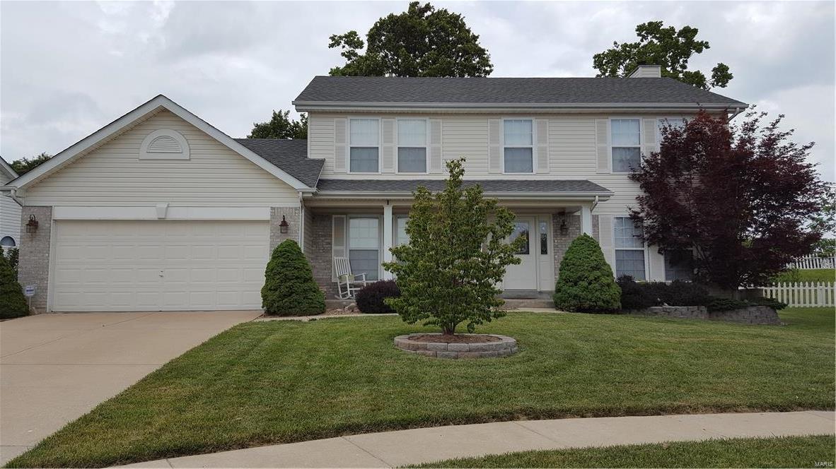 Rare opportunity in Peine Ridge... Wonderful two story home, offers large kitchen and breakfast room that walks out to attractive landscaped back yard, with white vinyl fence. Master bedroom and bath (separate shower and tub with garden windows) walk-in closet. Three additional bedrooms. Open main level, features great room with lots of windows and brick fireplace, large dining room and living room. Over sized laundry room with closet. Basement has a full bath rough in. Home has many extras and nice touches. Near Peine Ridge Elementary and Slash Station Aquatic Center