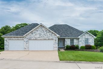 Fantastic Ranch Style home with 4 beds, 3 baths with approx 2500sf of living space on 1.5 acres.  This is a wonderful home with oversized kitchen, wall-oven, plenty of Maple cabinets, counterspace and pantry.  Spacious Open Floor plan from the dining room to vaulted living room with woodburning fireplace.  The main level has 3 bedrooms, 2 baths with Large Master Suite with walk-in closet, Private bath with separate shower & Garden tub.  The partially finished Walk-Out lower level has a HUGE family room, Wet-Bar, 1 bedroom, and 1 full bath.  This home is incredible with so many upgrades.  Oversized composite deck, lower level patio, main-floor laundry & mud room-- and an Oversize 3-car garage extra deep with Hydronic heating-- Yes- a heated garage.  The rear of the property has mature trees for privacy and is partially fenced.  Located in unincorporated Warren county on a Cul-de-sac.  This home is close to town and move-in ready.
