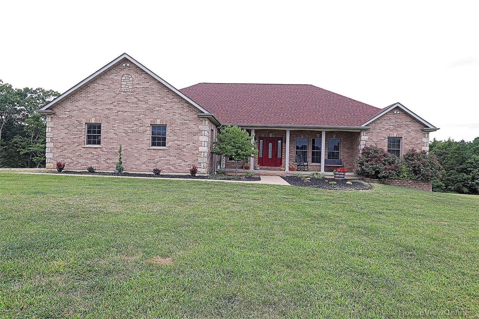 Gorgeous 3 bedroom, 3 bath home sitting on 4.62 acres just outside of town.  The home has 4200+ square feet of living space, attached garage & detached 30 x 35 garage with plenty off street parking. An open floor plan welcomes you home with large living room, dining room and kitchen with hardwood floors.  A dream kitchen awaits you with beautiful granite counter tops, soft close cabinets/drawers, pantry with pull out drawers & large center island. Enjoy a quick meal at the island or dine in the adjoining area.
A large covered deck makes the perfect place to start or end your day. The home has a split bedroom plan, spacious master bedroom & bath are a dream come true, double sinks, separate tub & shower and a massive walk in closet. The lower level has a very large family room with new flooring, sleeping area, bathroom with laundry in addition to the main floor laundry. Looking for privacy in the country but still close to town, call today this one won't last long!